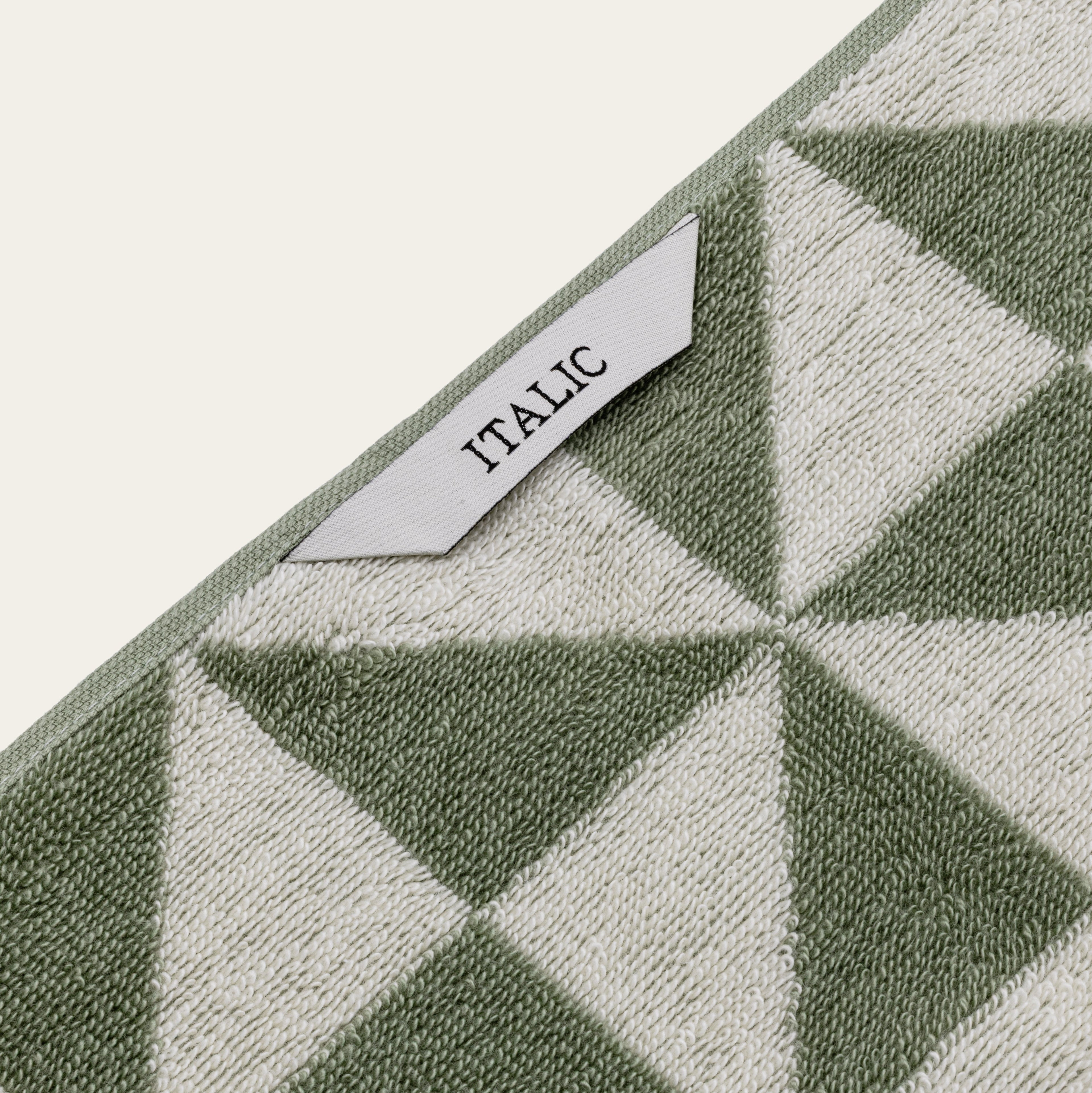 Italic Umbra Australian Cotton Bath Towel displayed on a bathroom hook, showcasing soft, plush texture and clean white color.