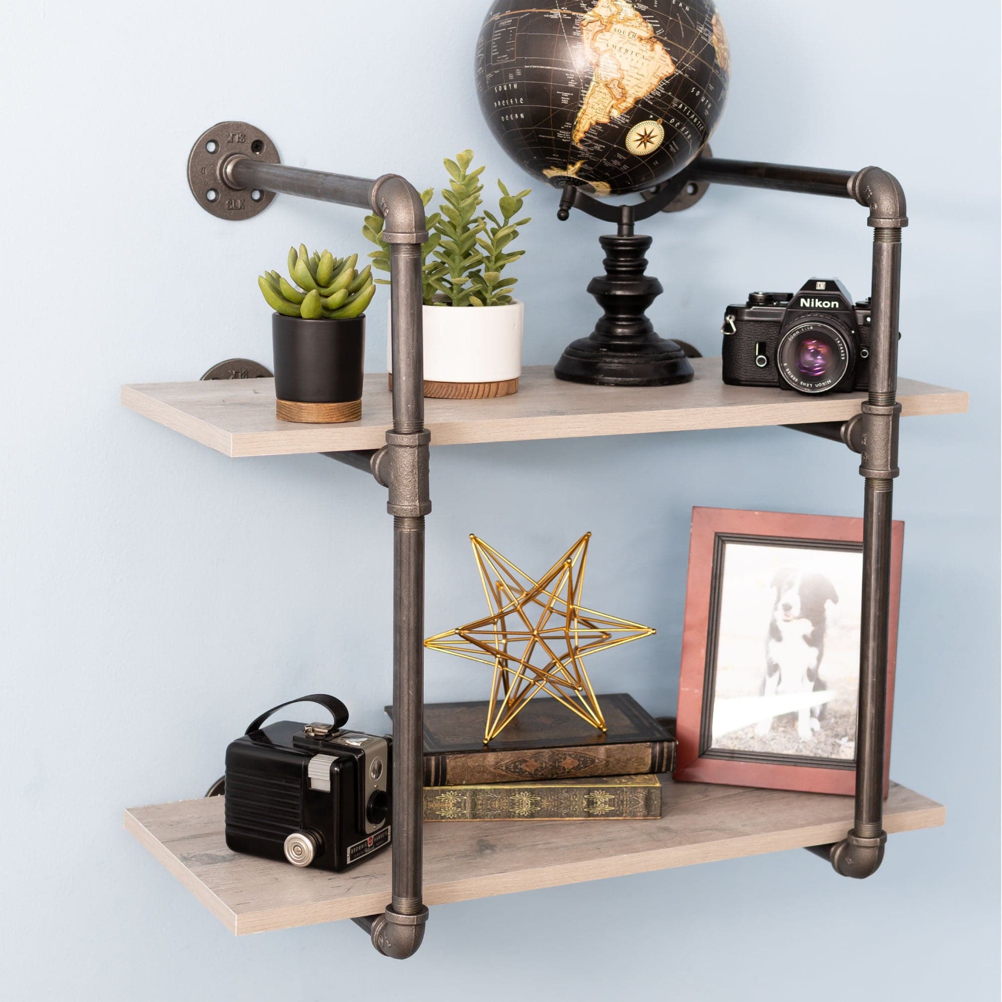 Two-tier wall-mounted shelf brackets by Pipe Decor, showing black metal design and sturdy mounting hardware.