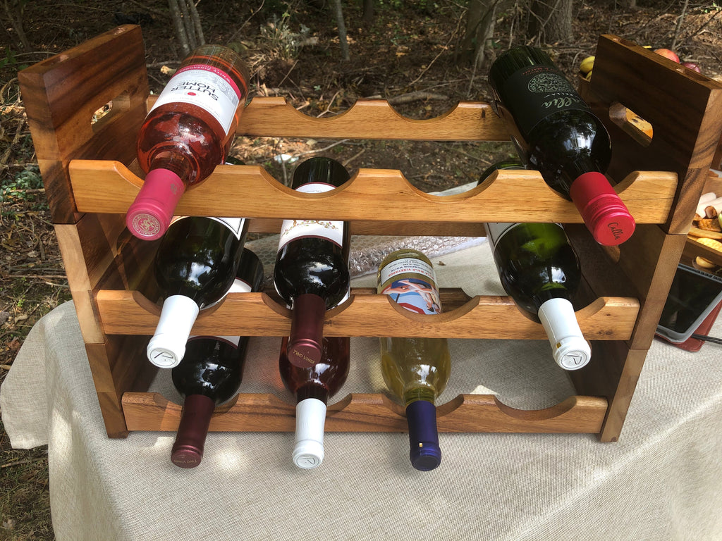 Kalmar Home stackable tabletop wine rack with multiple slots for organizing wine bottles on a flat surface.