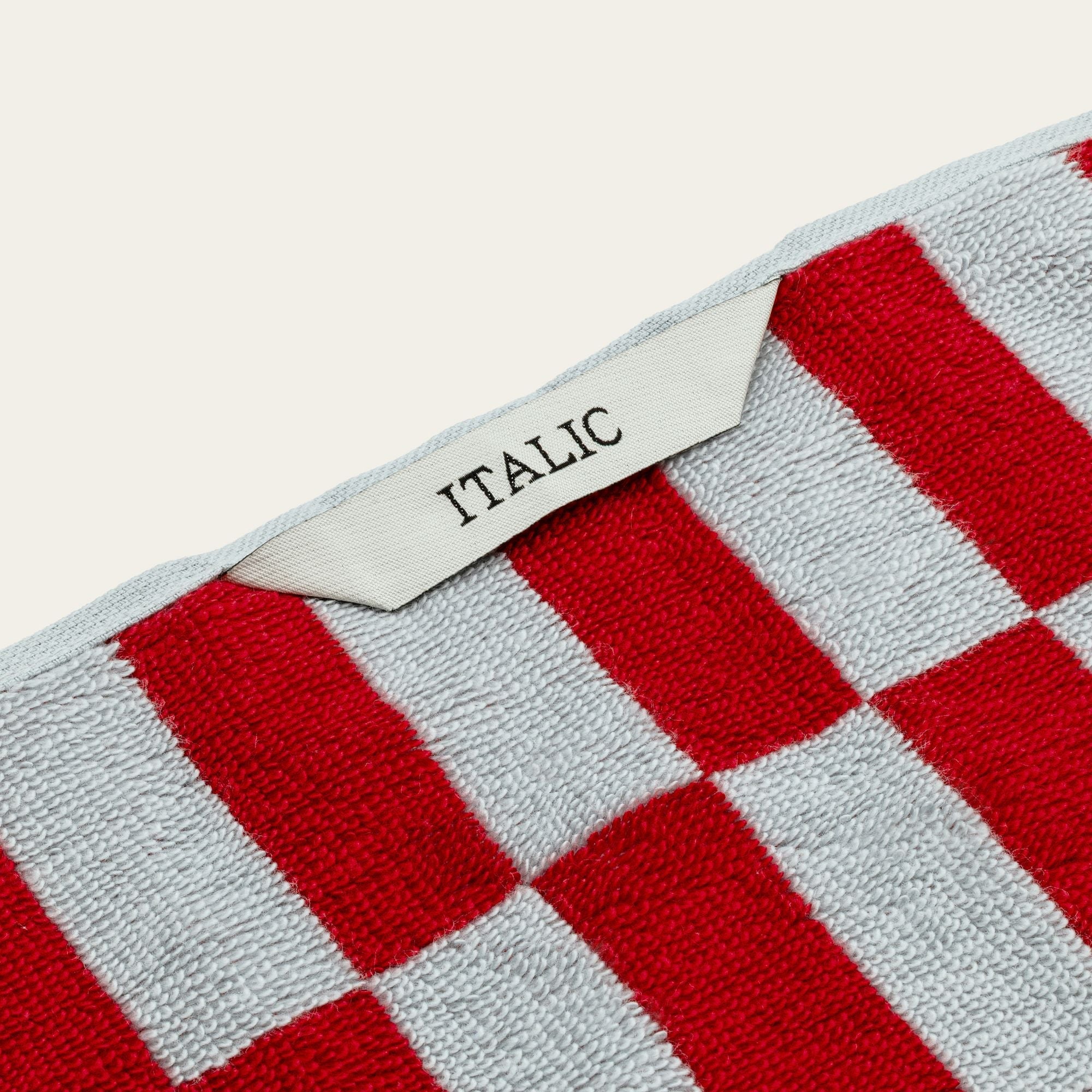 Soft white Pietra Australian Cotton towel from Italic with a textured, woven pattern, displayed folded on a neutral background.