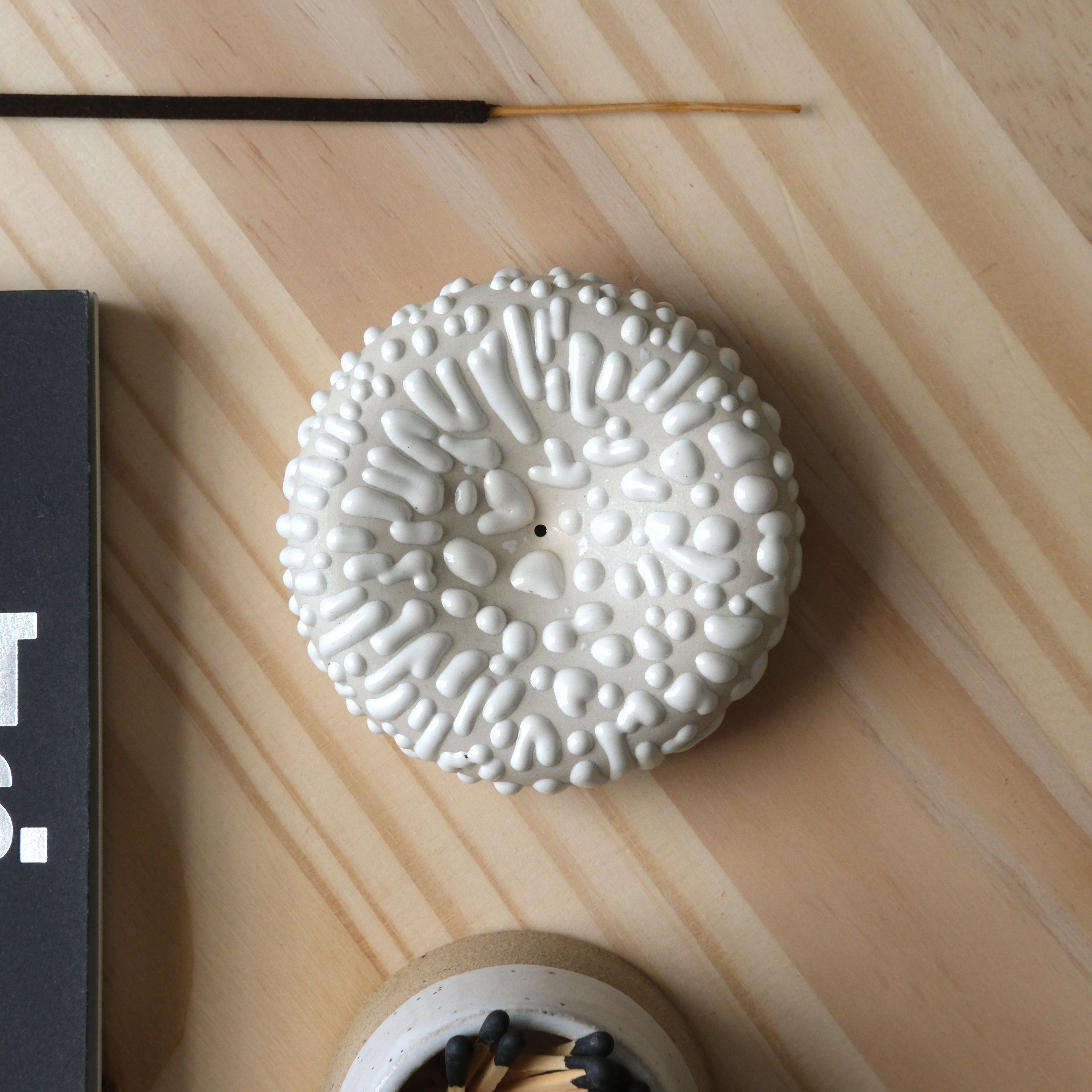 White Eve Incense holder with a bird and eye design, a stylish home accessory by Misewell.