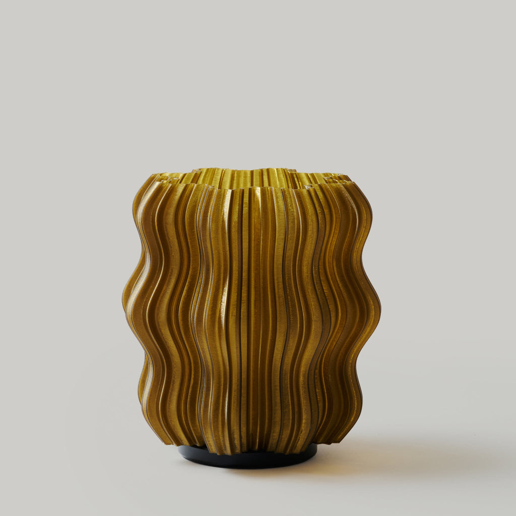 Wooj Design cordless mini wavy lamp in green with a sleek, modern design and adjustable wavy light pattern.