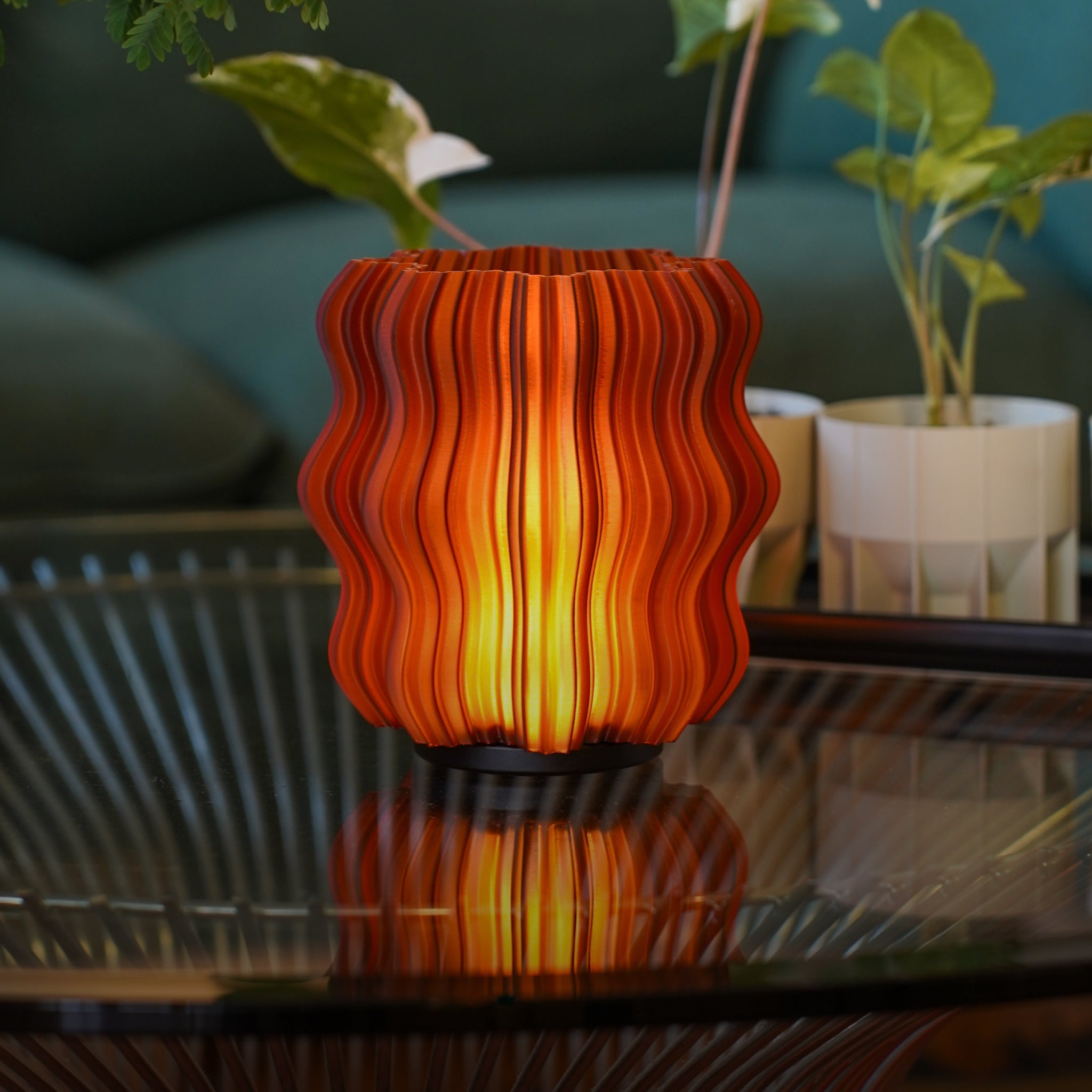 Wooj Design cordless mini wavy amber lamp glowing softly, modern LED night light with wavy design for cozy ambiance.