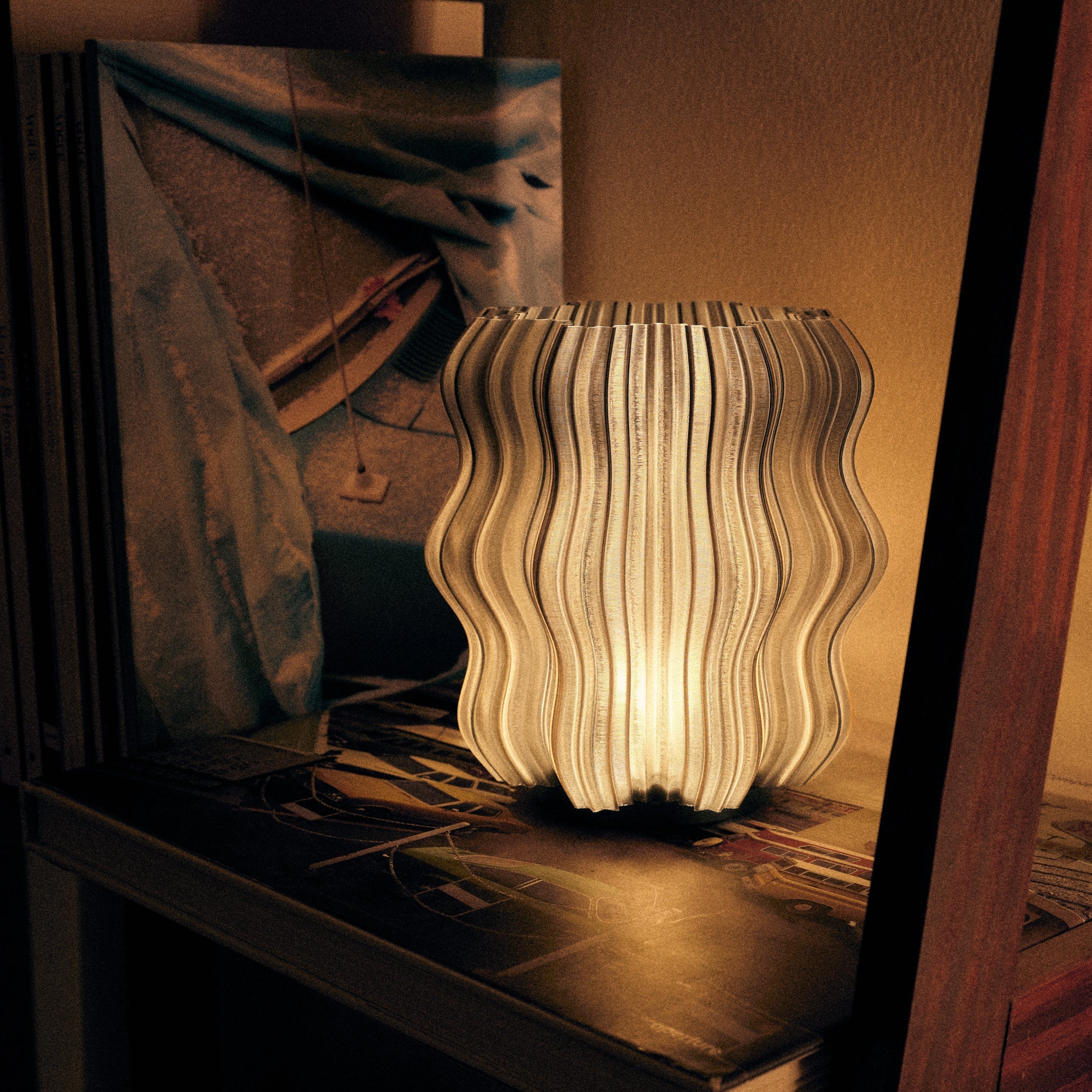 Wooj Design cordless mini wavy lamp emitting soft smoky light, placed on a modern side table in a cozy living room setting