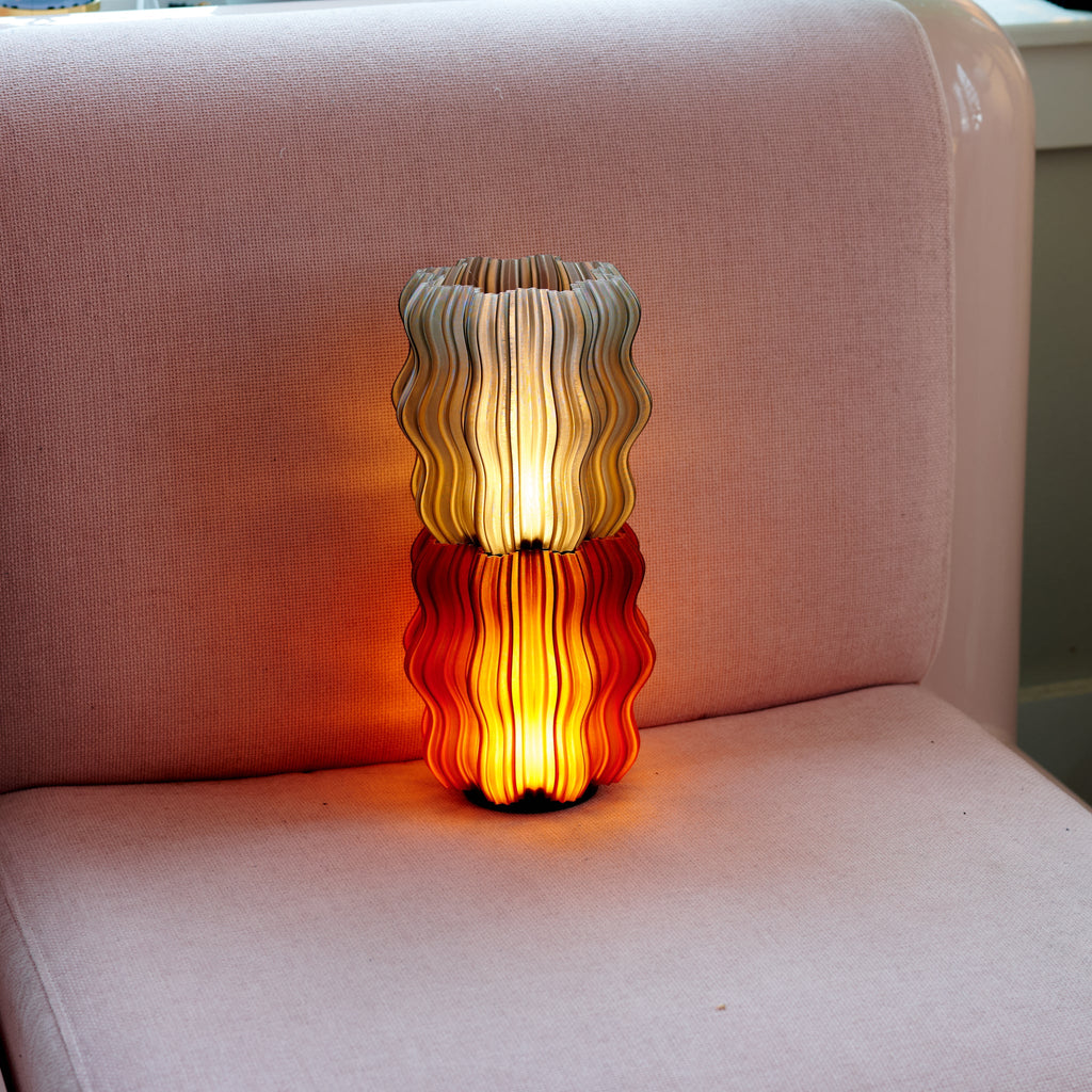 Wooj Design cordless mini wavy lamp stacked with layered, wavy glass design for modern decorative lighting.