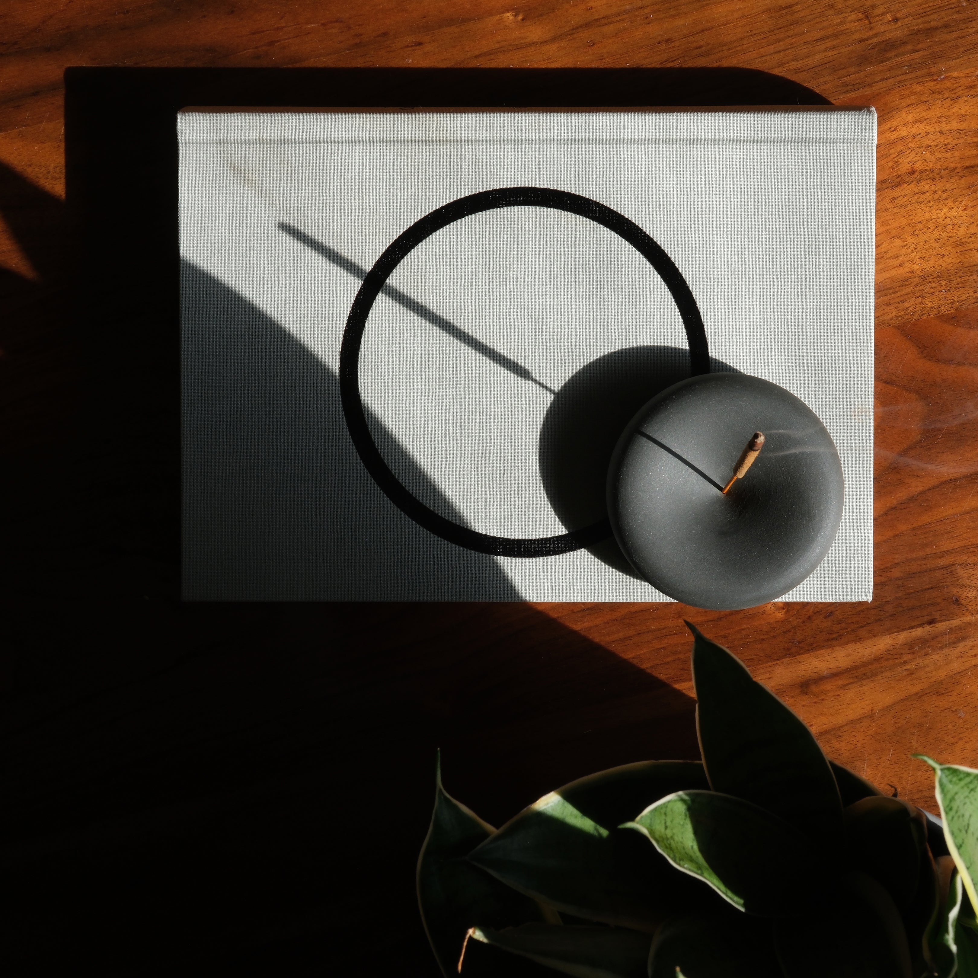 Misewell Eve Incense home accessory with a sleek holder and burning incense stick, adding a calming ambiance to any space.