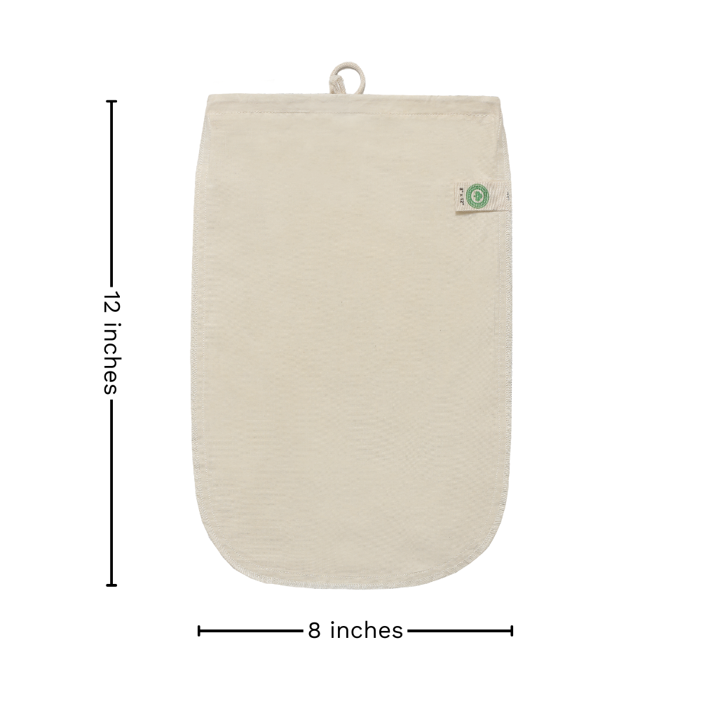 Organic cotton nut milk bag used as a strainer, showing its fine mesh and durable cotton material for nut milk making.