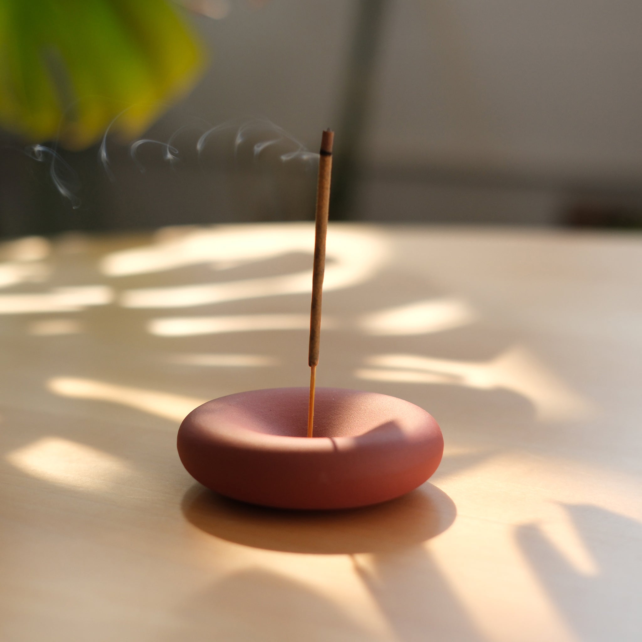 Square image of Eve Incense by Misewell, a home accessory featuring a decorative incense holder with burning incense sticks.