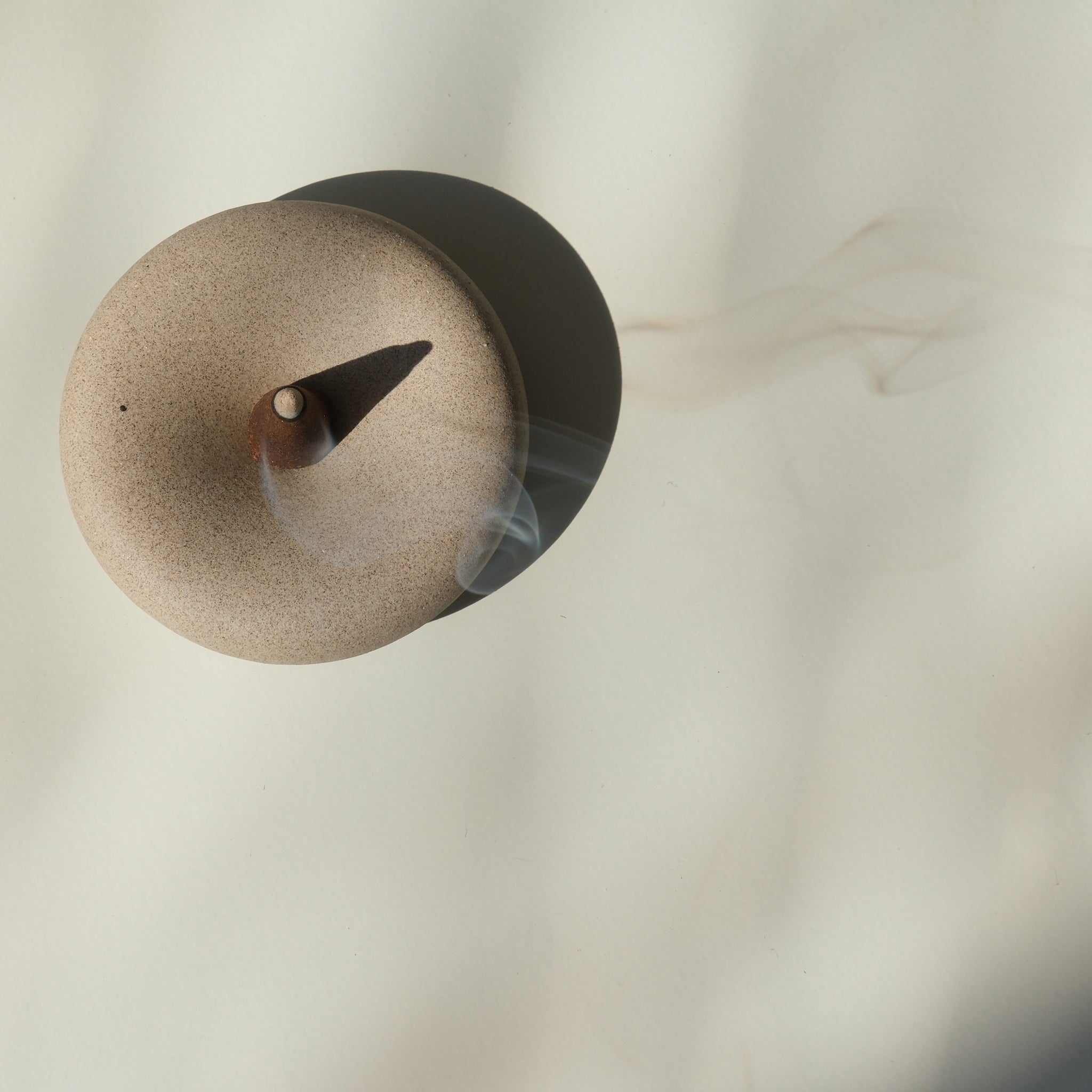 Dark sand-colored Eve incense holder by Misewell, serving as a stylish home accessory for incense burning.