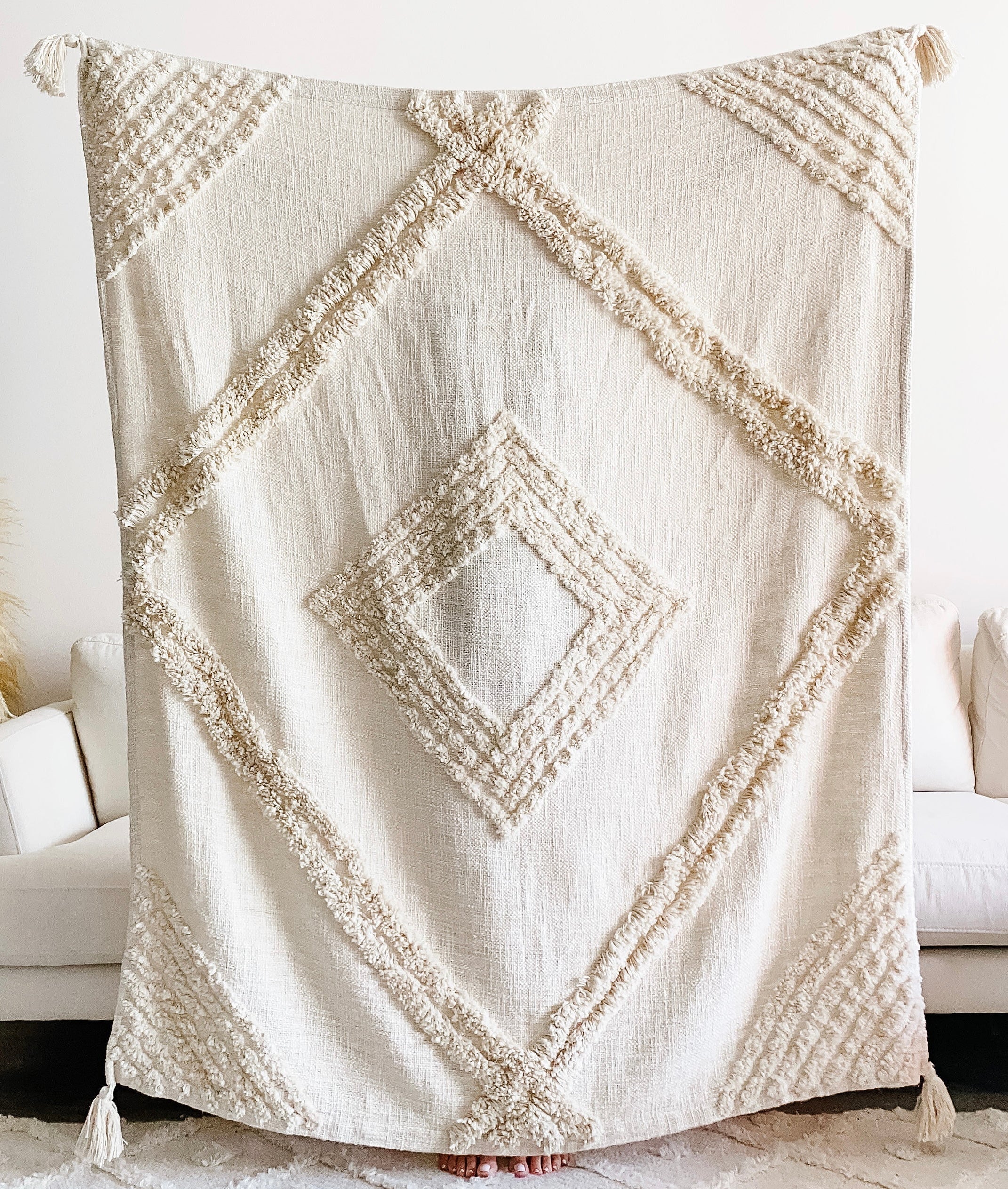 Boho-style Ava Throw Blanket by Busa Designs featuring colorful woven patterns on soft fabric.