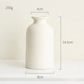 Simple ceramic vase in Nordic style with a smooth finish and neutral color, perfect for minimalistic home decor.