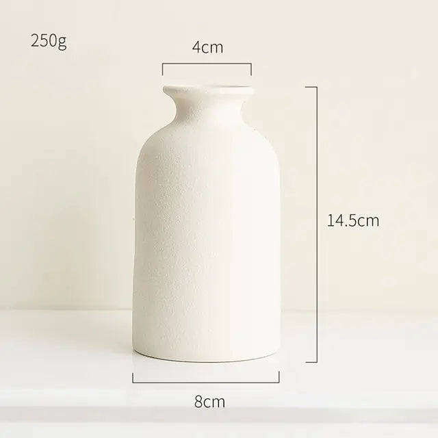 Simple ceramic vase in Nordic style with a smooth finish and neutral color, perfect for minimalistic home decor.