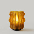 Mini wavy lamp by Wooj Design with a sleek, wave-shaped design in gray, perfect for modern home decor.