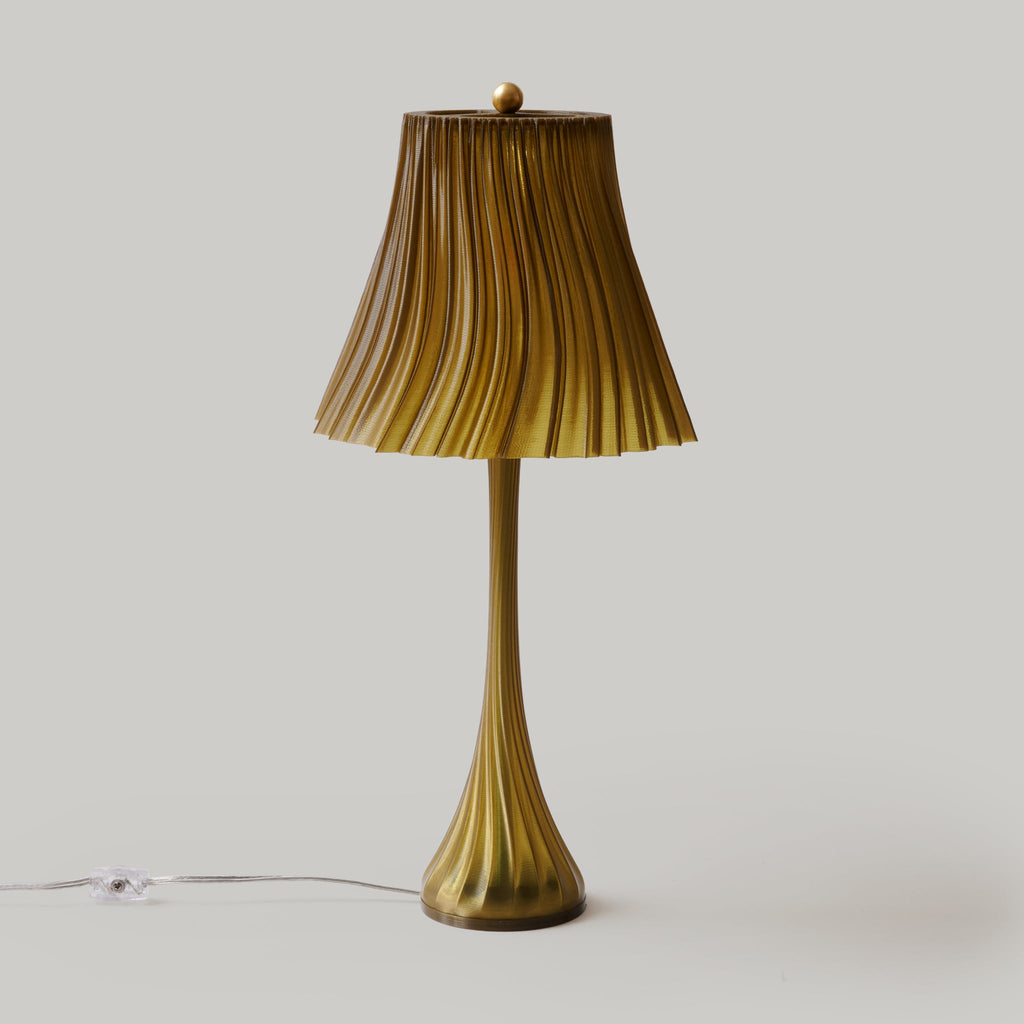 Wooj Design pleat lamp with a modern, textured fabric shade and sleek base, designed for stylish home lighting.