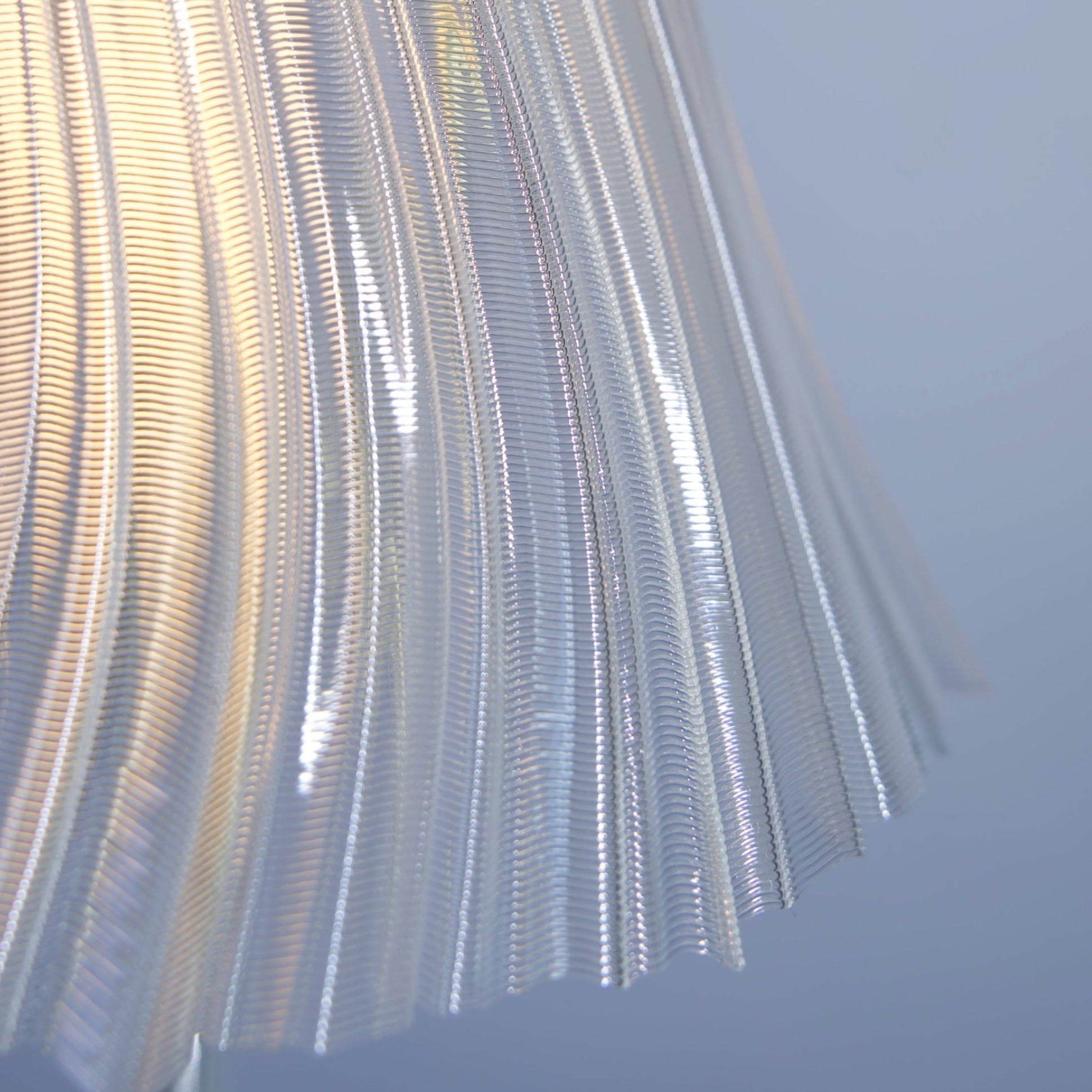 Slim tall Pleat Lamp by Wooj Design featuring a modern pleated fabric shade and sleek base, ideal for contemporary home lighting.