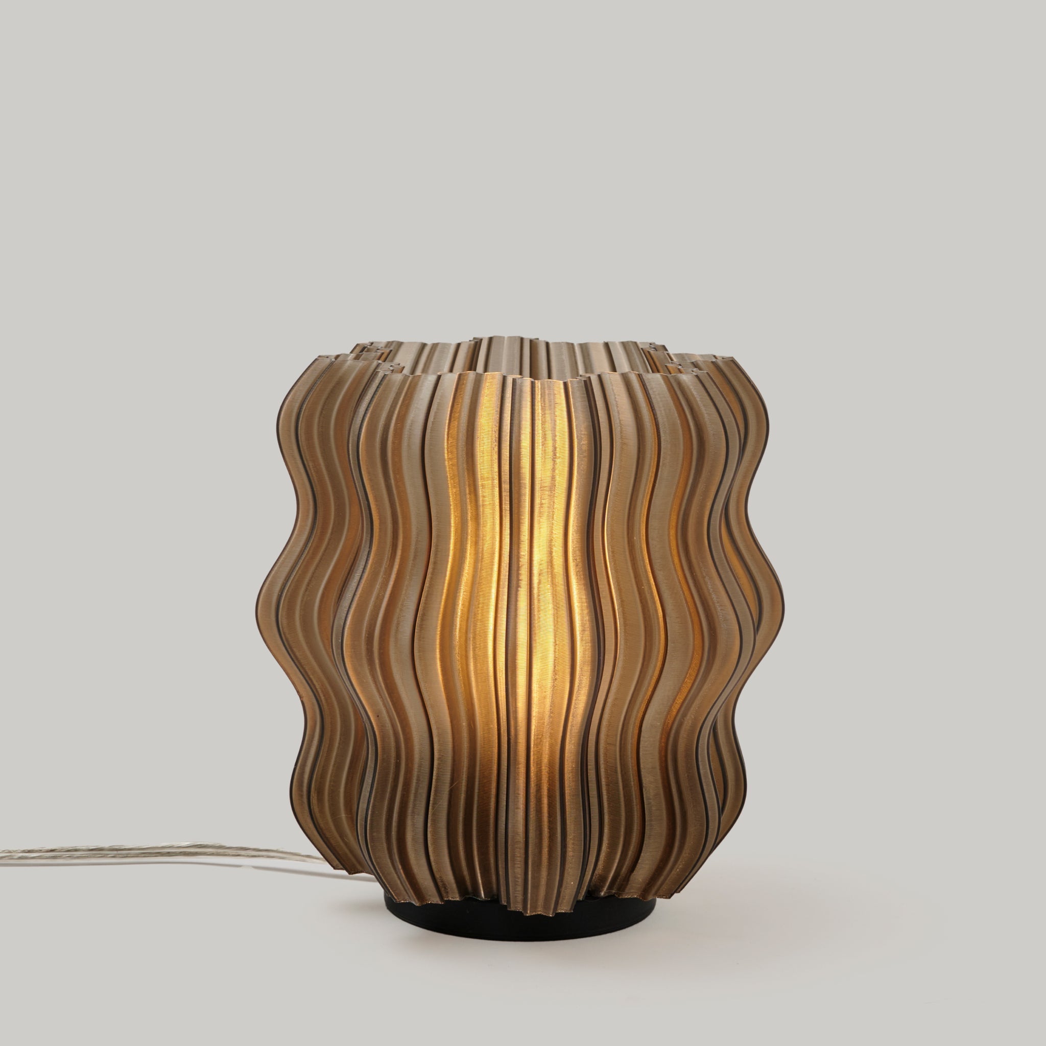 Mini Wavy Lamp by Wooj Design featuring a sleek, wavy design with a smoky finish, perfect for modern home lighting.