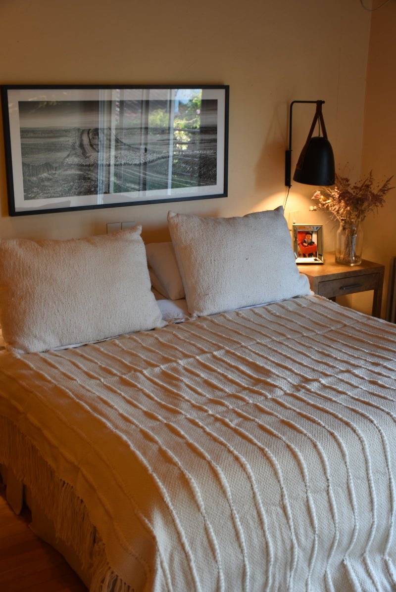 Multi striped natural throw blanket by Homelosophy, soft cozy throw for sofa or bed with colorful striped pattern.
