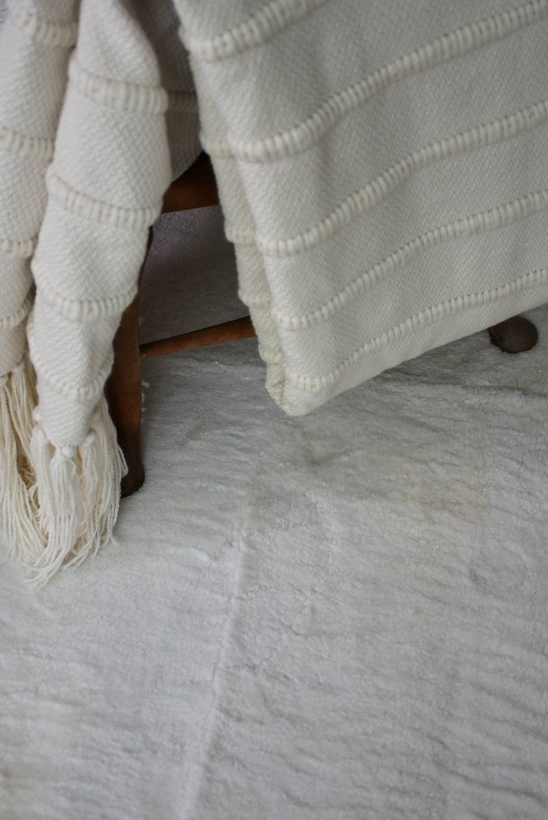 Homelosophy multi-striped natural throw blanket showing soft fabric and vibrant striped pattern for cozy home decor.