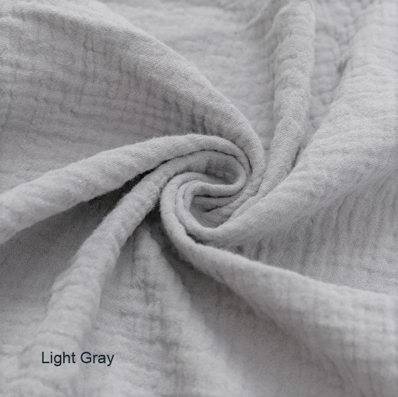 Light gray Wendy Anne Snuggle Me Infant Lounger slip cover made of organic cotton double gauze, shown on a baby lounger.