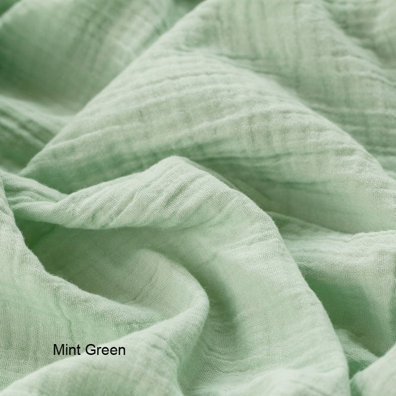 Mint green organic cotton double gauze duvet cover for Snuggle Me infant lounger by Wendy Anne, showing soft, breathable fabric.