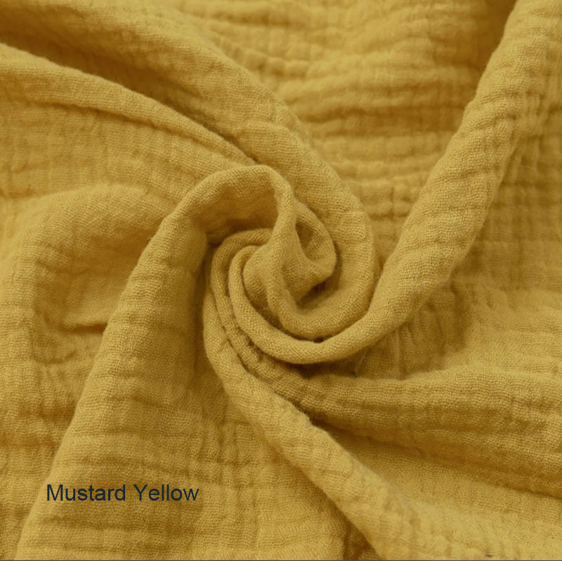 Mustard yellow organic cotton double gauze duvet cover for Snuggle Me infant lounger by Wendy Anne, showing soft, breathable fabric.