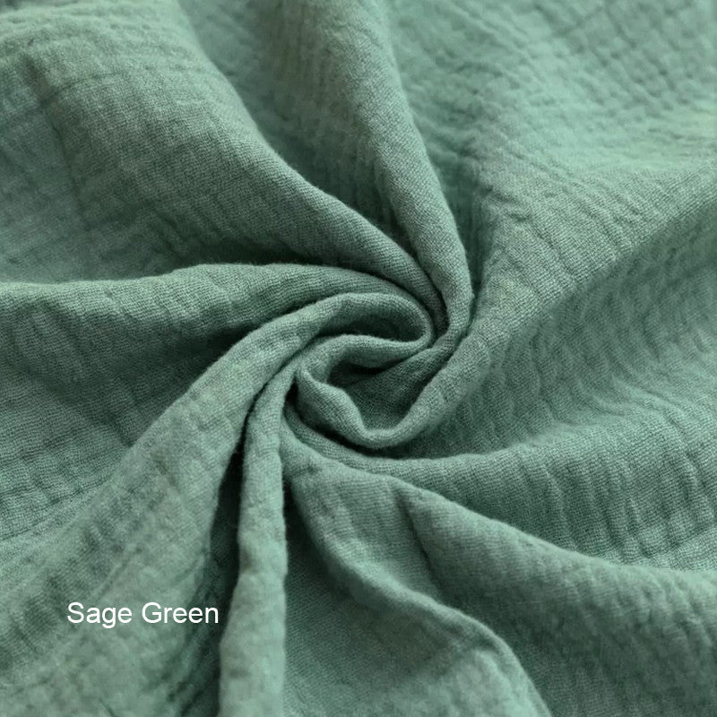 Sage green organic cotton double gauze duvet cover for Snuggle Me infant lounger by Wendy Anne, showing soft, breathable fabric.