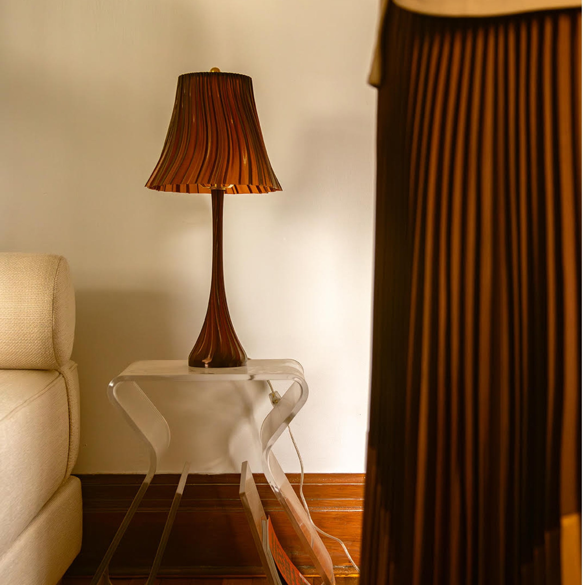 Amber pleat lamp by Wooj Design, stylish table lamp with pleated fabric shade and warm glow, perfect for modern home decor.