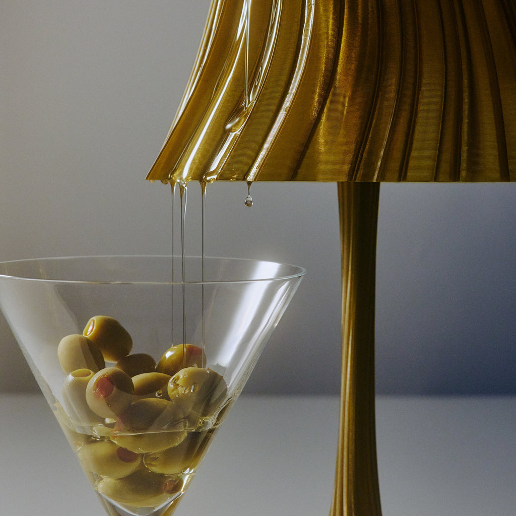 Close-up of Wooj Design Pleat Lamp in olive oil color, showcasing its pleated fabric lampshade design.