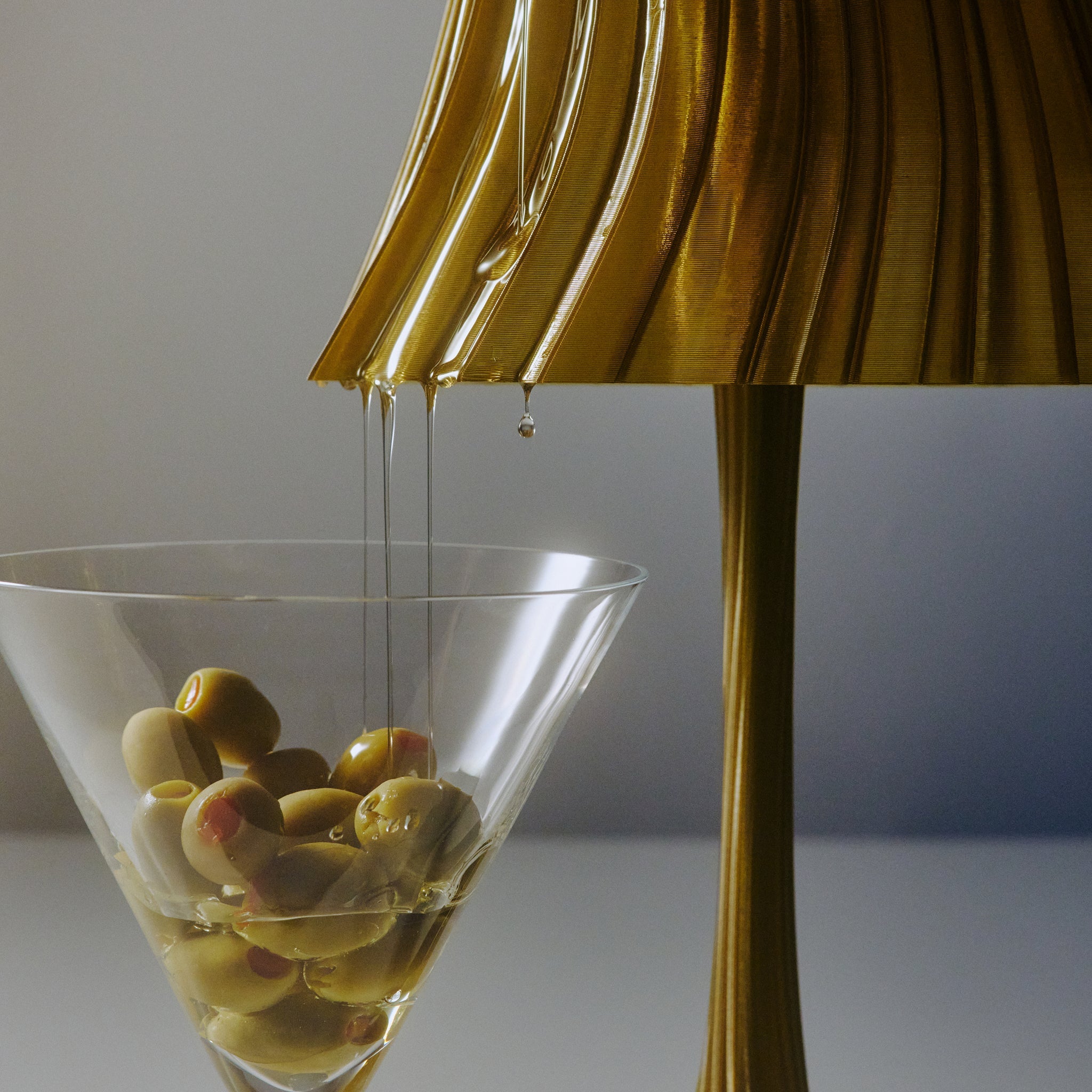 Close-up of Wooj Design Pleat Lamp in olive oil color, showcasing its pleated fabric lampshade design.