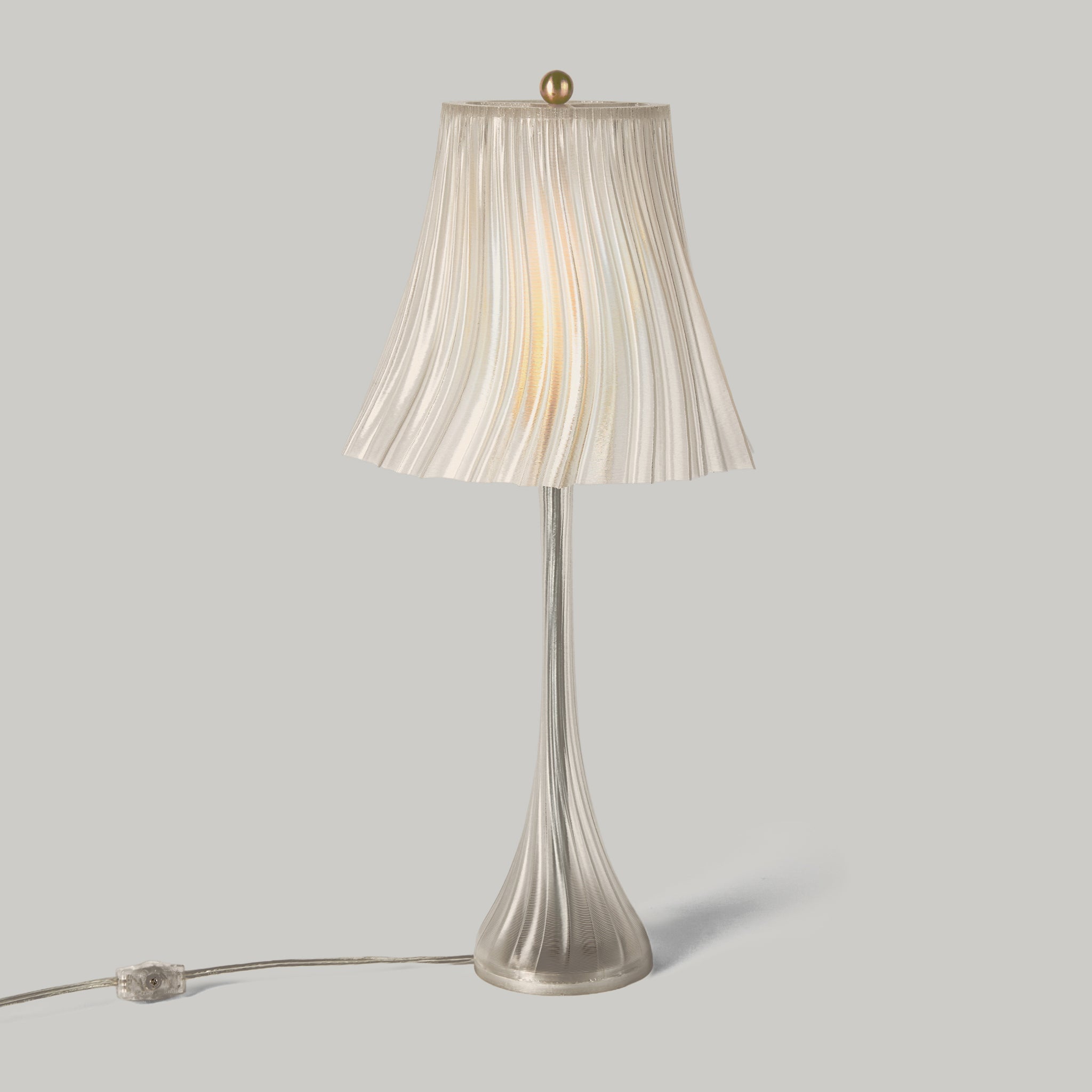 Wooj Design Pleat Lamp with a clear glass Silo shade, featuring elegant pleated fabric design for modern home lighting.