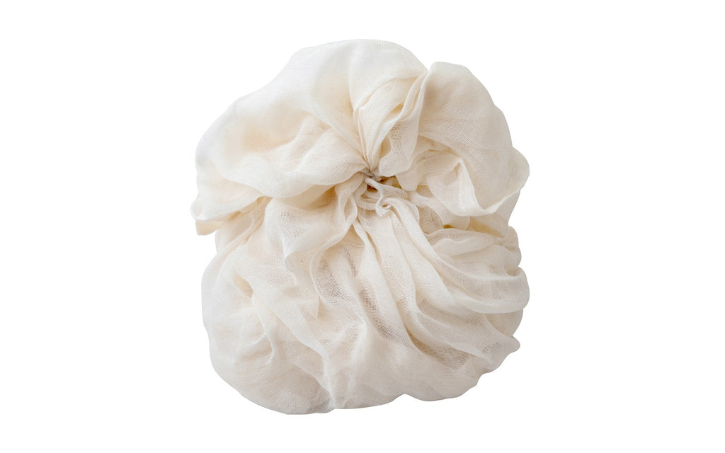 Reusable organic cotton cheesecloth for kitchen straining and food preparation, lightweight and breathable for kitchen use.