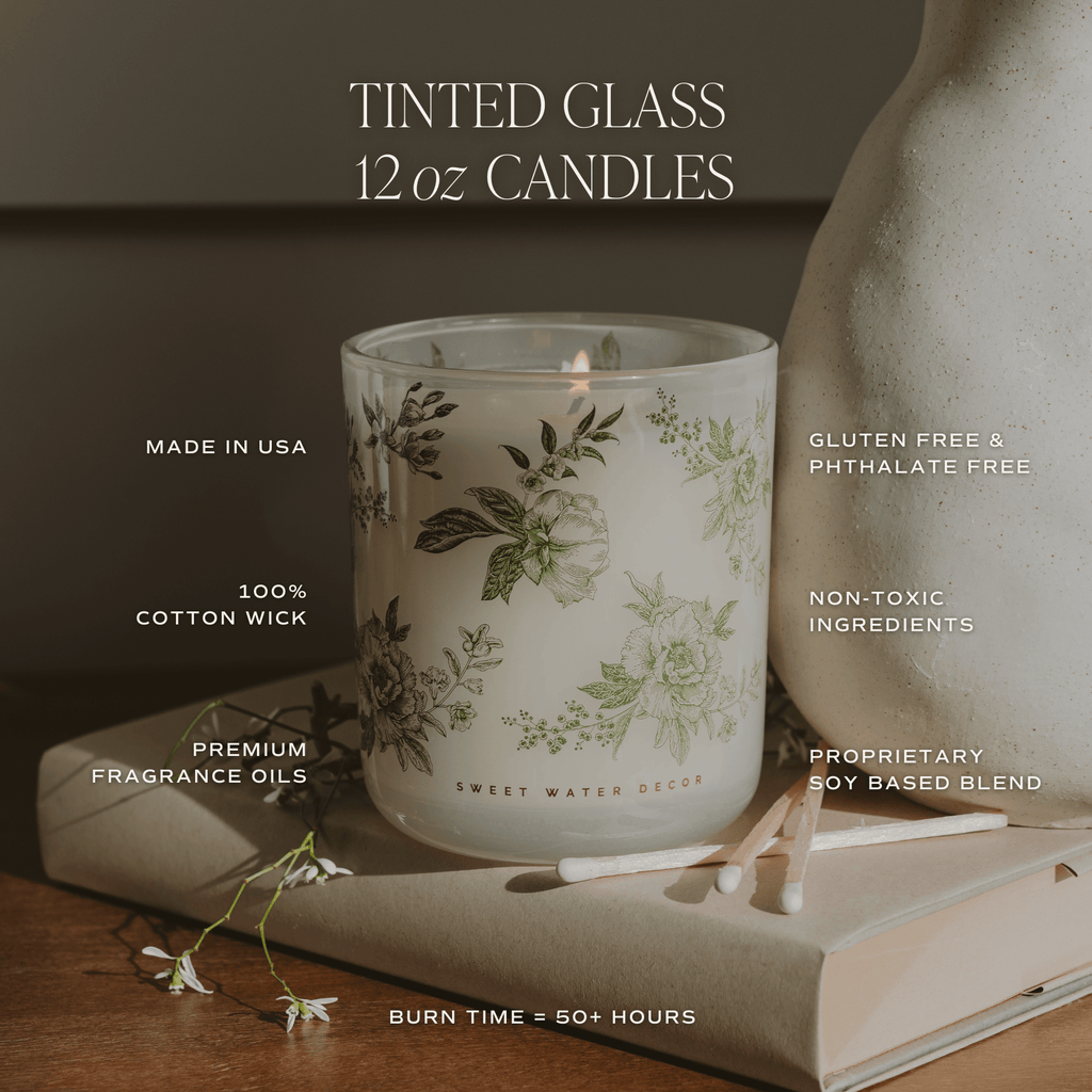 Green floral soy candle in a white tinted glass jar, 12 oz, with lavender and sage scent, by Sweet Water Decor.