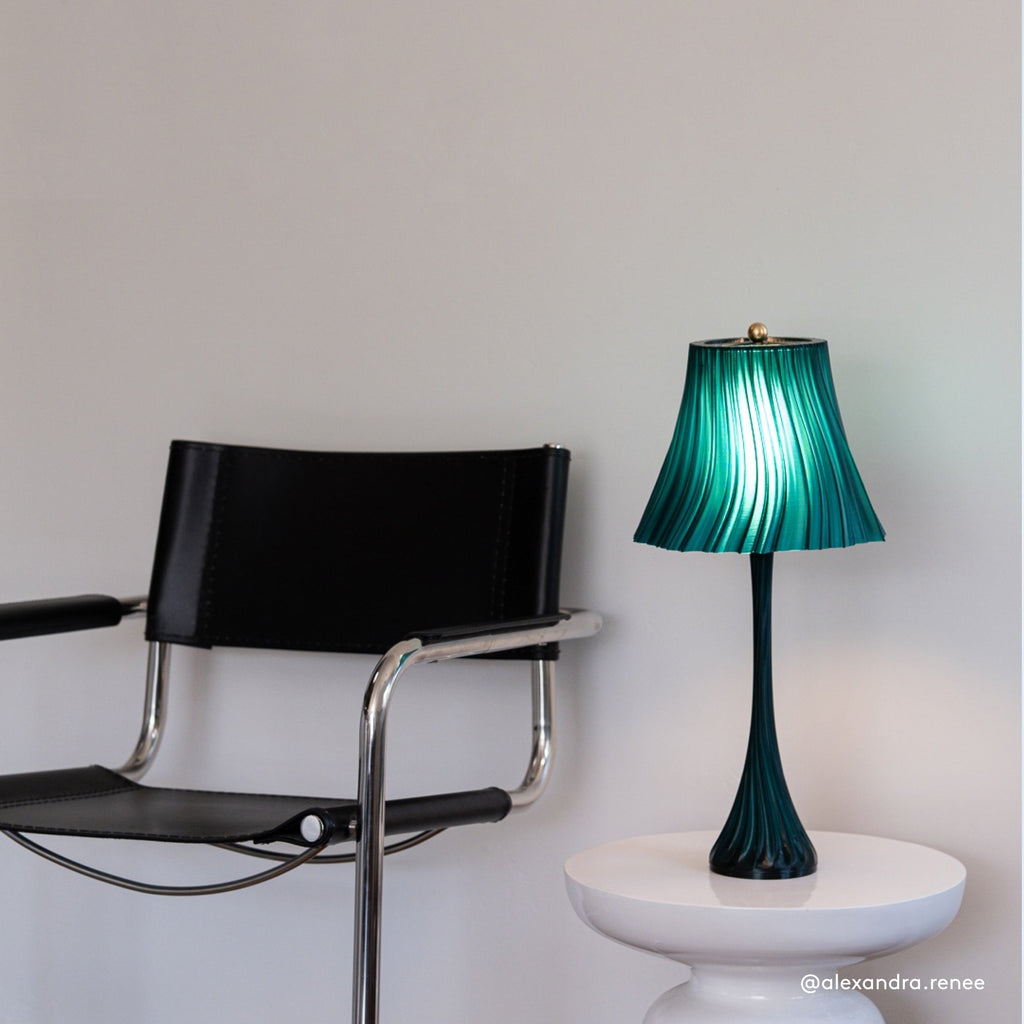 Wooj Design Pleat Lamp with textured fabric shade and sleek base, modern lighting fixture for living room or bedroom decor.