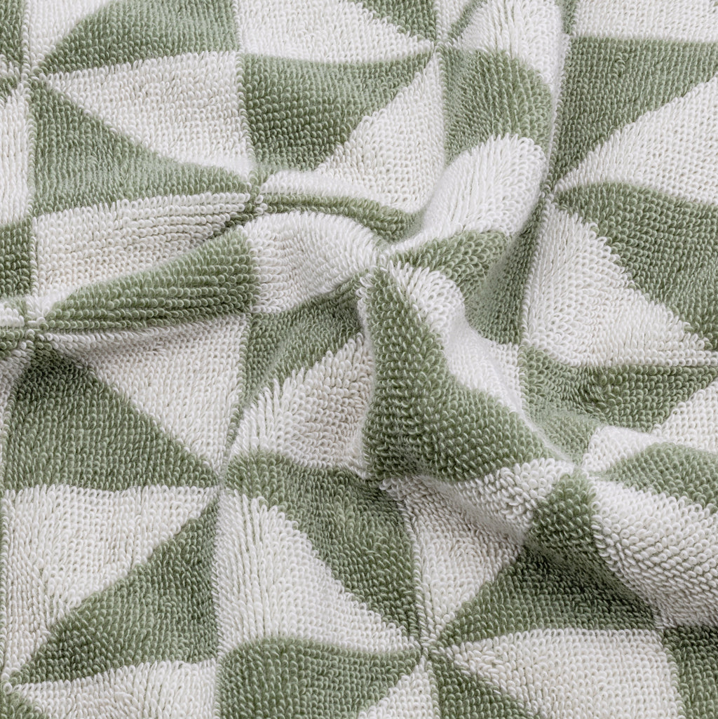 Swatch of Umbra Australian Cotton Towels by Italic showing soft, white, plush bath towels with a textured weave pattern.