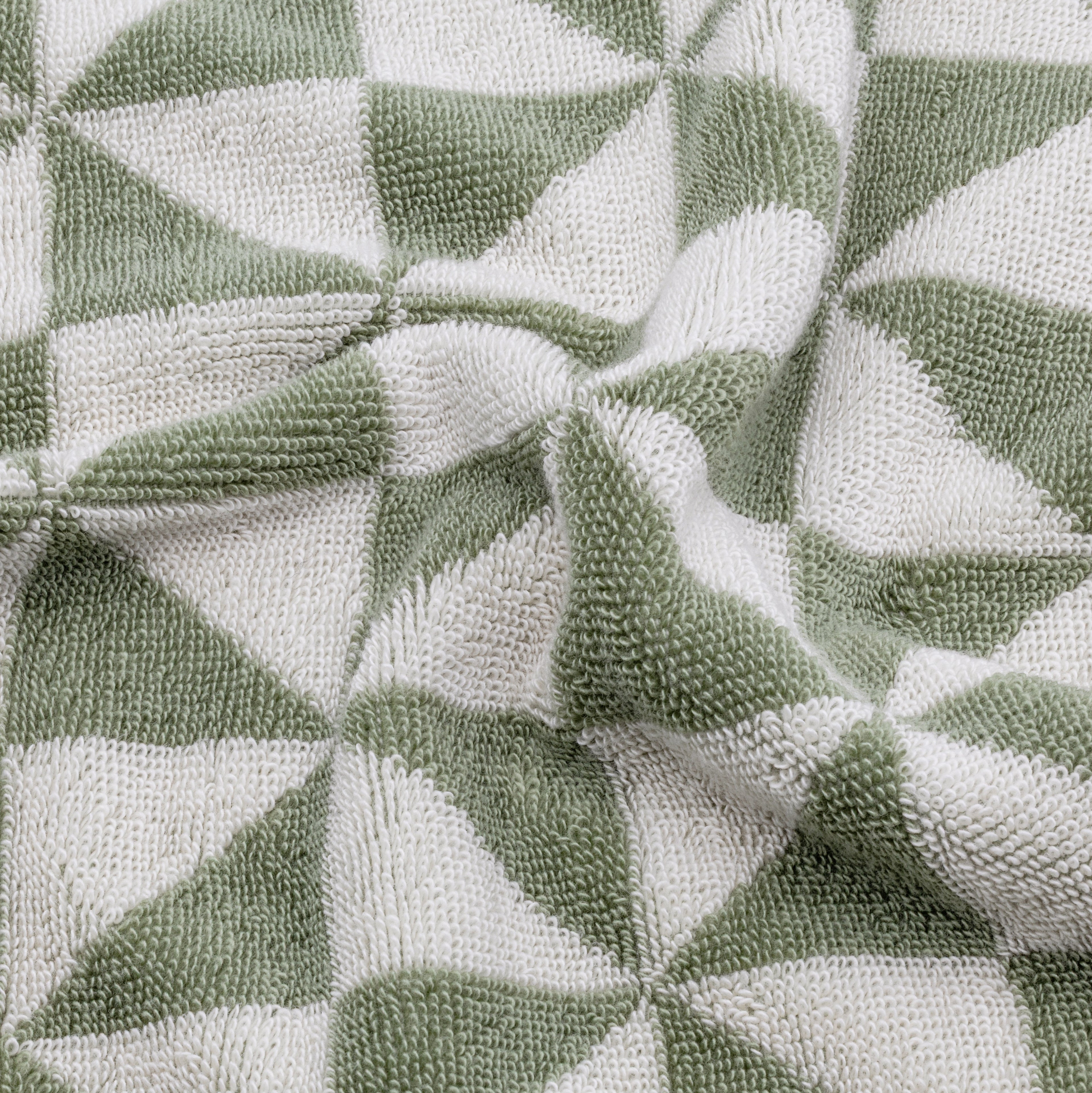 Swatch of Umbra Australian Cotton Towels by Italic showing soft, white, plush bath towels with a textured weave pattern.