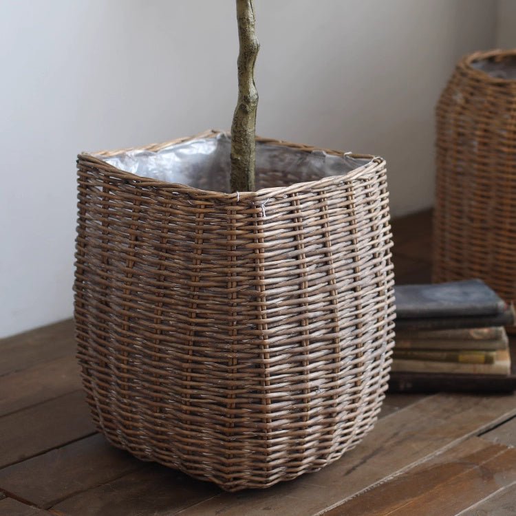Natural wicker floor planter basket with liner by RusticReach, showing a woven wicker design and a removable fabric liner.