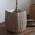 Natural wicker floor planter basket with liner by RusticReach, showing a woven wicker design and a removable fabric liner.