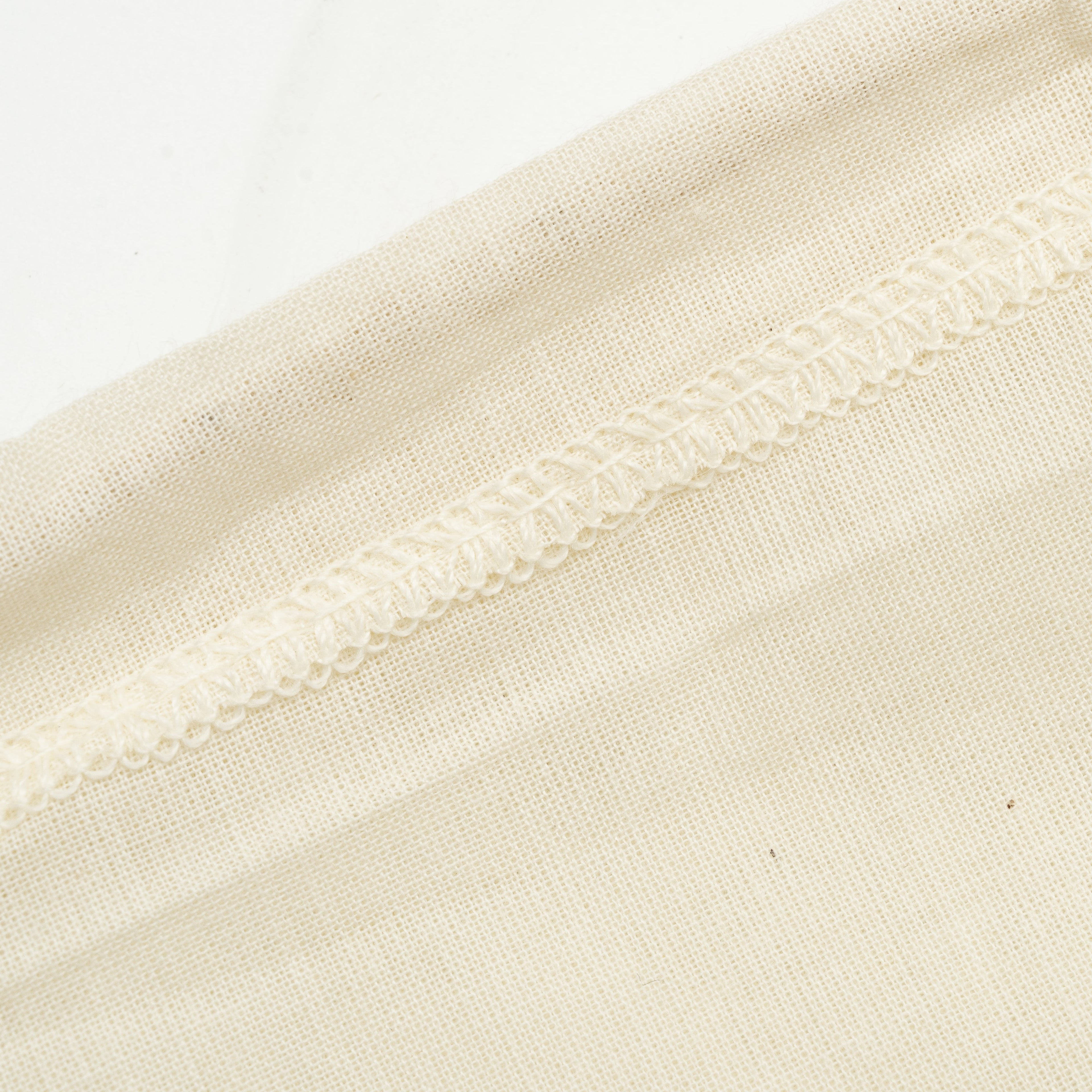 Organic cotton nut milk bags used as cheesecloth or strainers for nut milk and plant-based beverages.