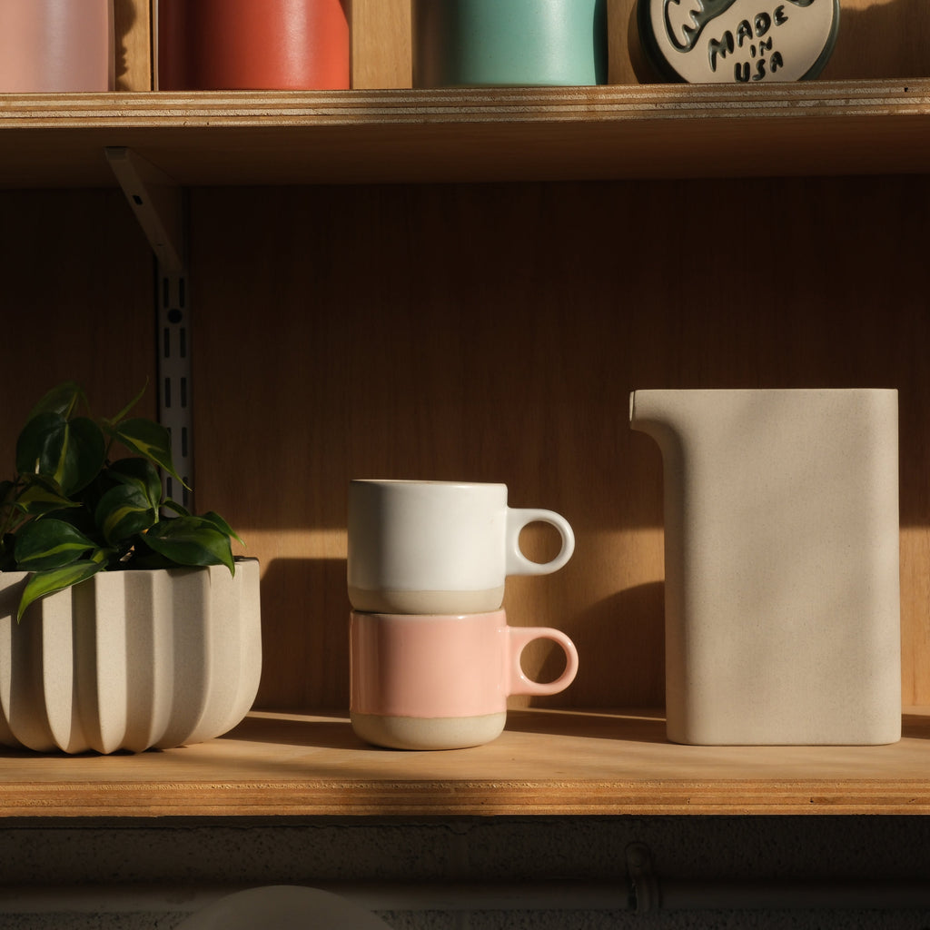 Misewell Scotty Mug tumbler with dipped design, shown on a shelf with other ceramic mugs.