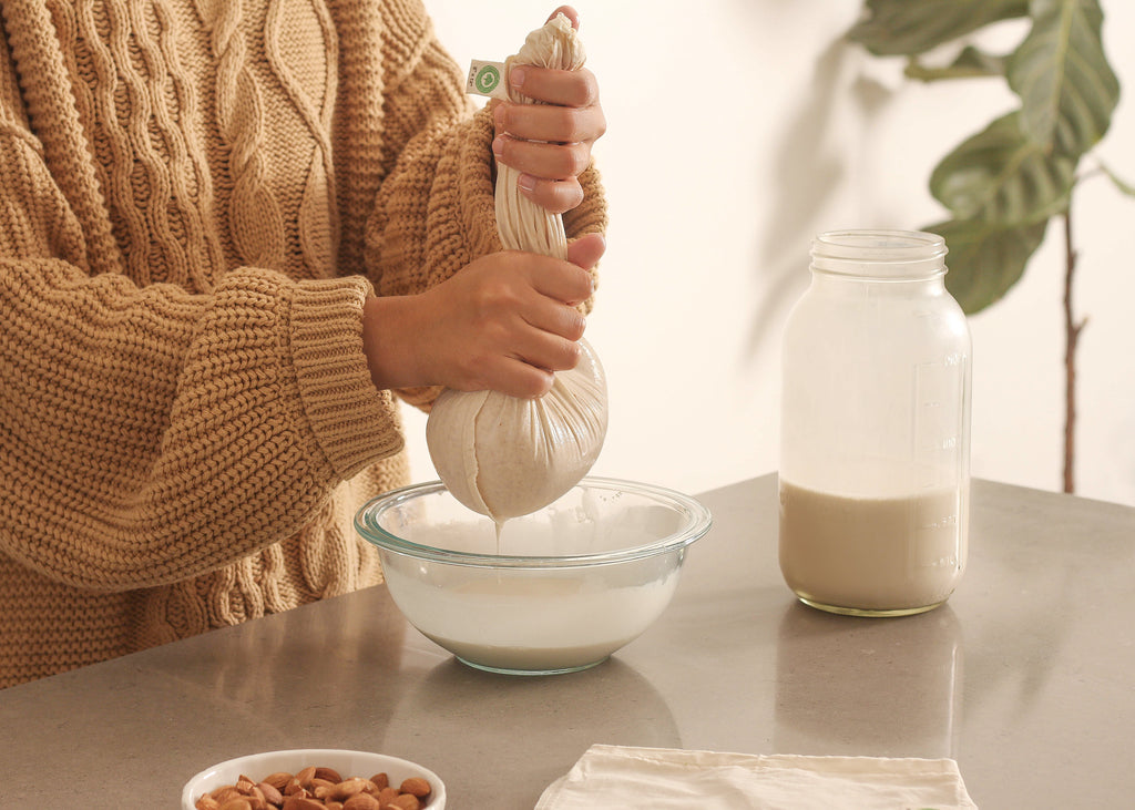Organic Cotton Mart nut milk bags used as colanders and strainers for homemade nut milk and nut-based recipes.
