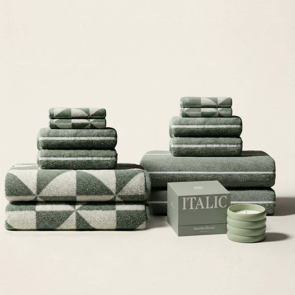 Set of Umbra Australian Cotton Towels from Italic, soft plush bath towels displayed on a clean bathroom shelf.