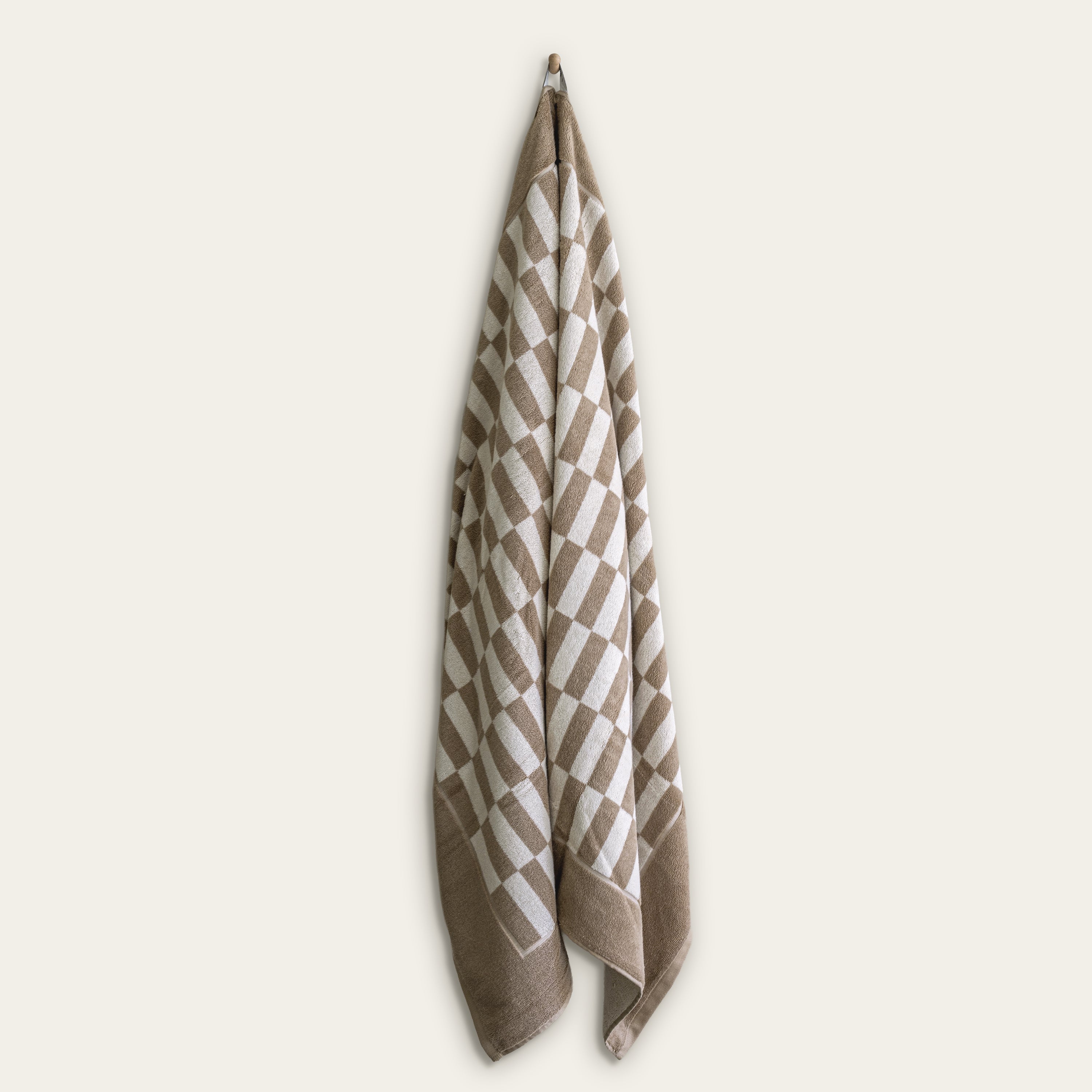 Italic Pietra Australian Cotton bath sheet displaying plush, soft white towels with a textured weave pattern, ideal for luxurious drying.