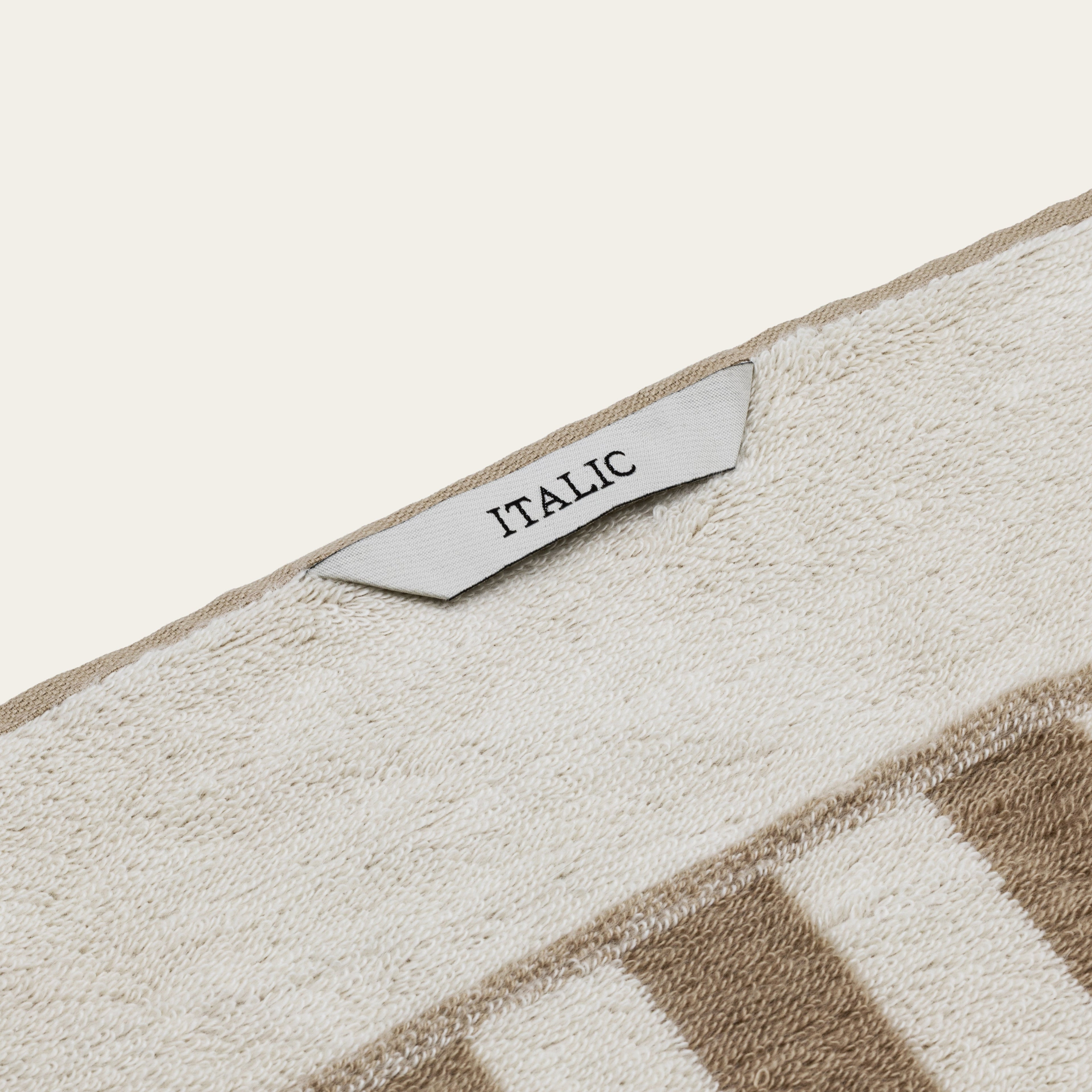Australian cotton Pietra bath sheet by Italic, showing soft, plush terry cloth with a neutral color and large size for luxurious drying.