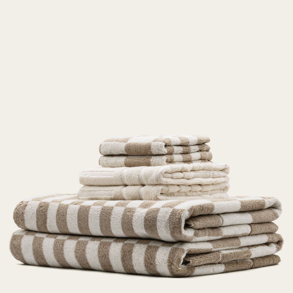 Soft Pietra Australian Cotton Towels by Italic, featuring plush texture and neutral color, displayed folded on a clean bathroom surface.