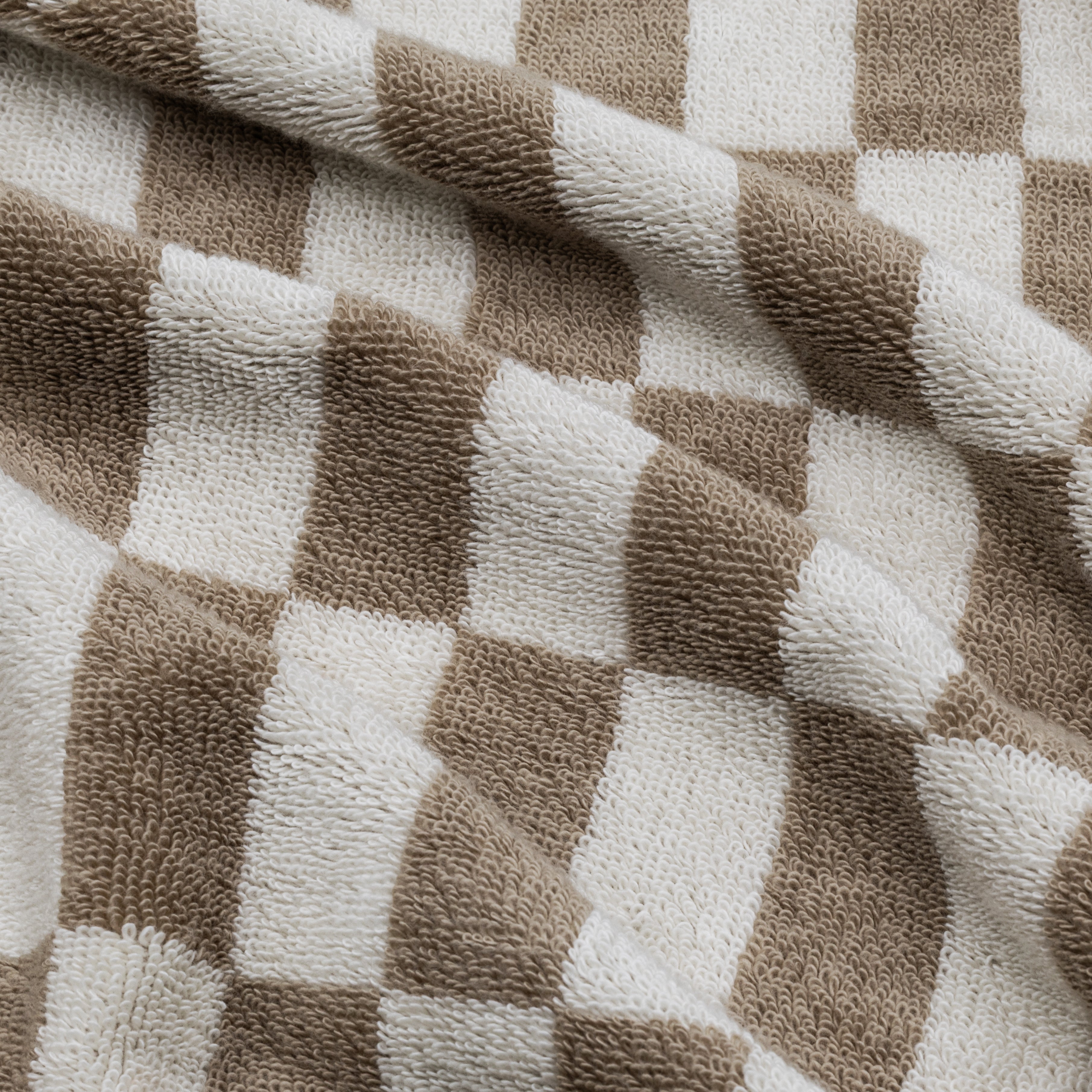 Swatch of Pietra Australian Cotton Towels by Italic showing soft, plush fabric in neutral tones for luxurious bathroom use.
