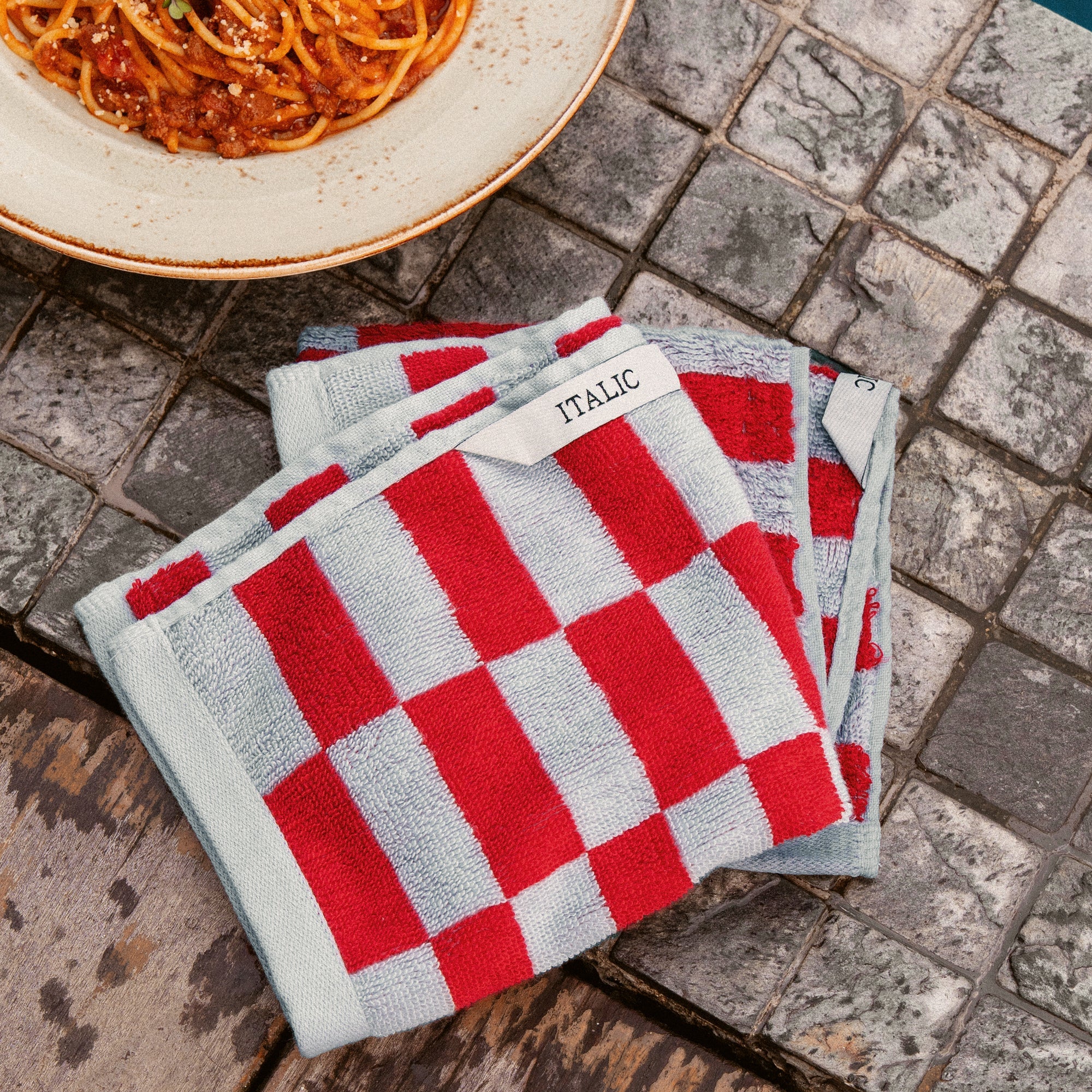 Orange Pietra Australian Cotton washcloth from Italic, soft and plush with a textured surface for gentle skincare.