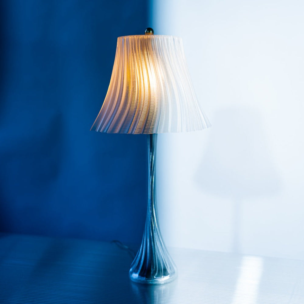 Wooj Design Pleat Lamp with a clear, pleated fabric shade, showcasing elegant modern lighting for interior decor.