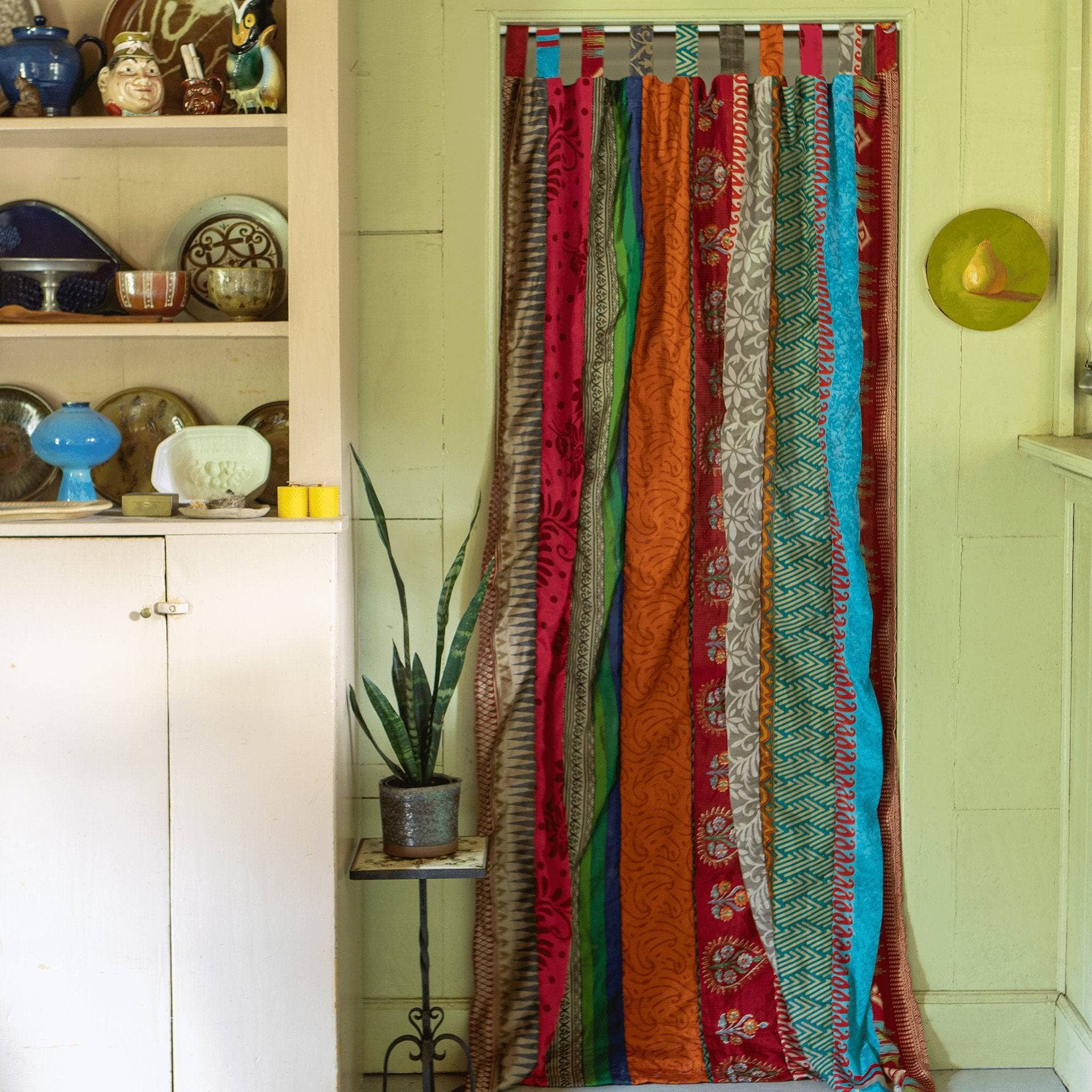 Colorful Rainbow Oasis upcycled sari drapes from Darn Good Yarn, eco-friendly boho curtains with crochet and knit details.