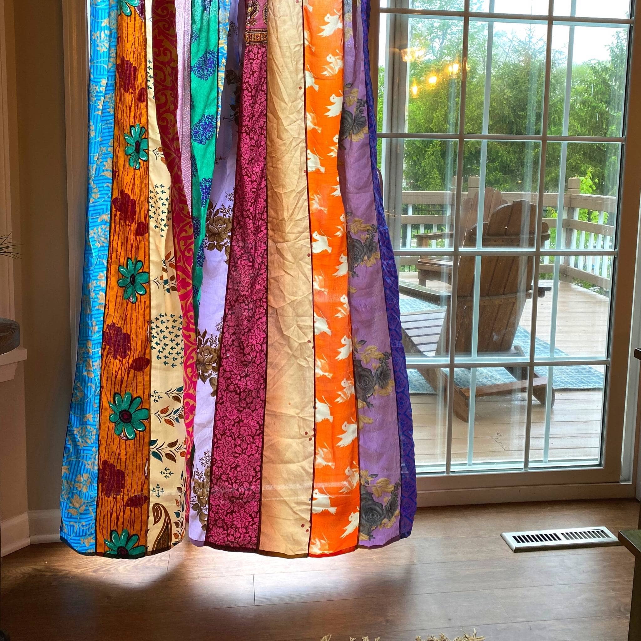 Rainbow Oasis upcycled sari curtains by Darn Good Yarn, colorful boho outdoor patio decor with crochet-knit details.
