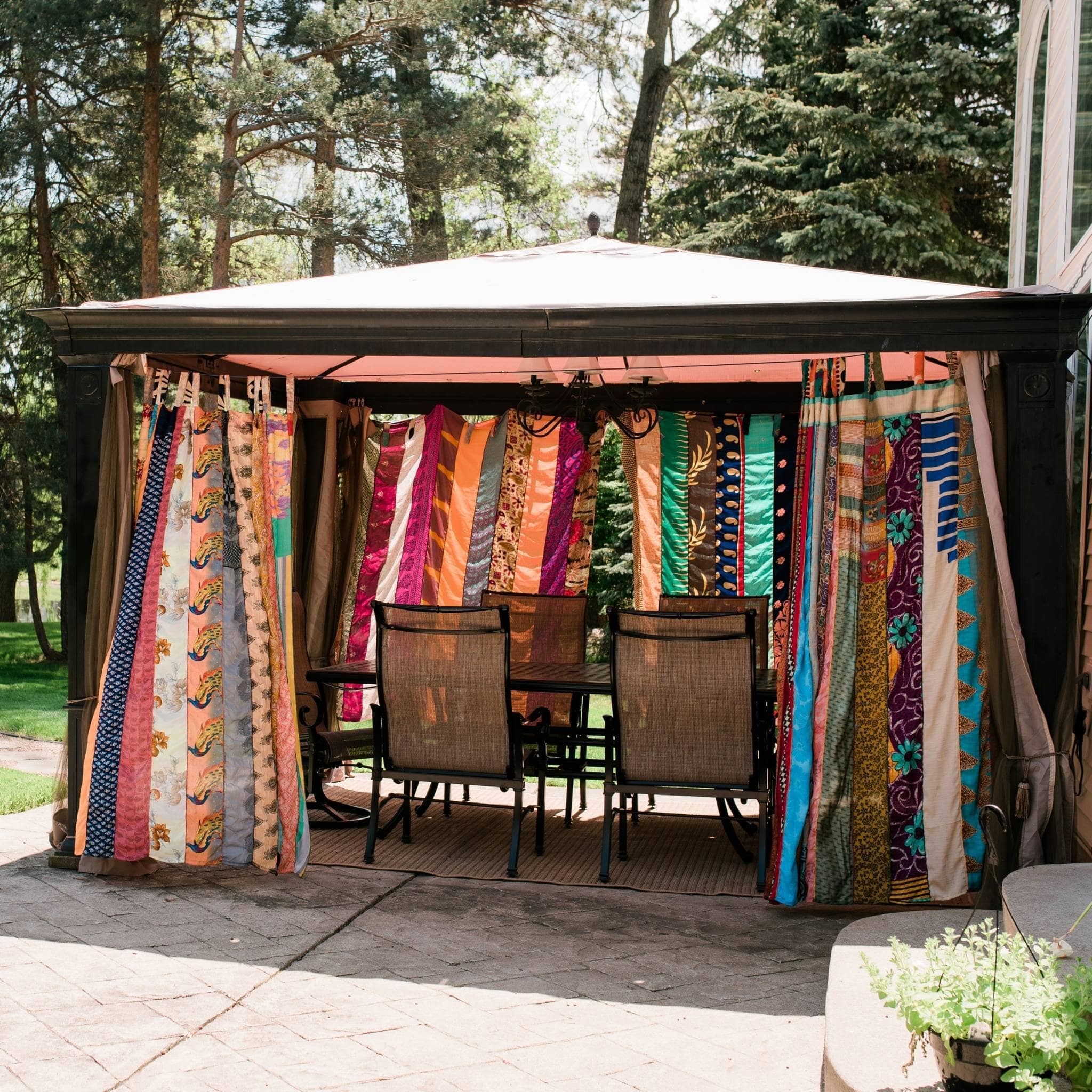 Colorful Rainbow Oasis Drape from Darn Good Yarn, eco-friendly boho curtains made from recycled sari fabric for outdoor or indoor decor.